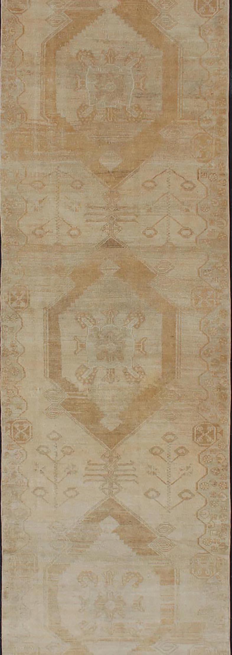 Vintage Turkish Oushak Runner with Multi-Medallion Design in Muted Color Palette In Good Condition For Sale In Atlanta, GA