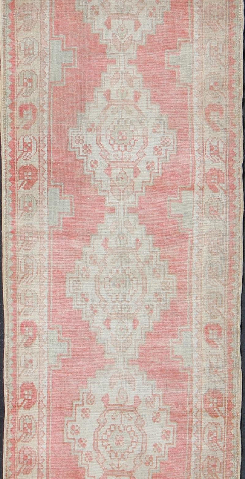 Hand-Knotted Vintage Turkish Oushak Runner with Multi-Medallion Design in Muted Red and Ivory For Sale