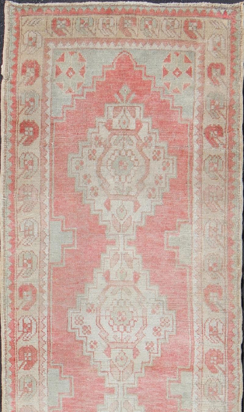 Vintage Turkish Oushak Runner with Multi-Medallion Design in Muted Red and Ivory In Good Condition For Sale In Atlanta, GA