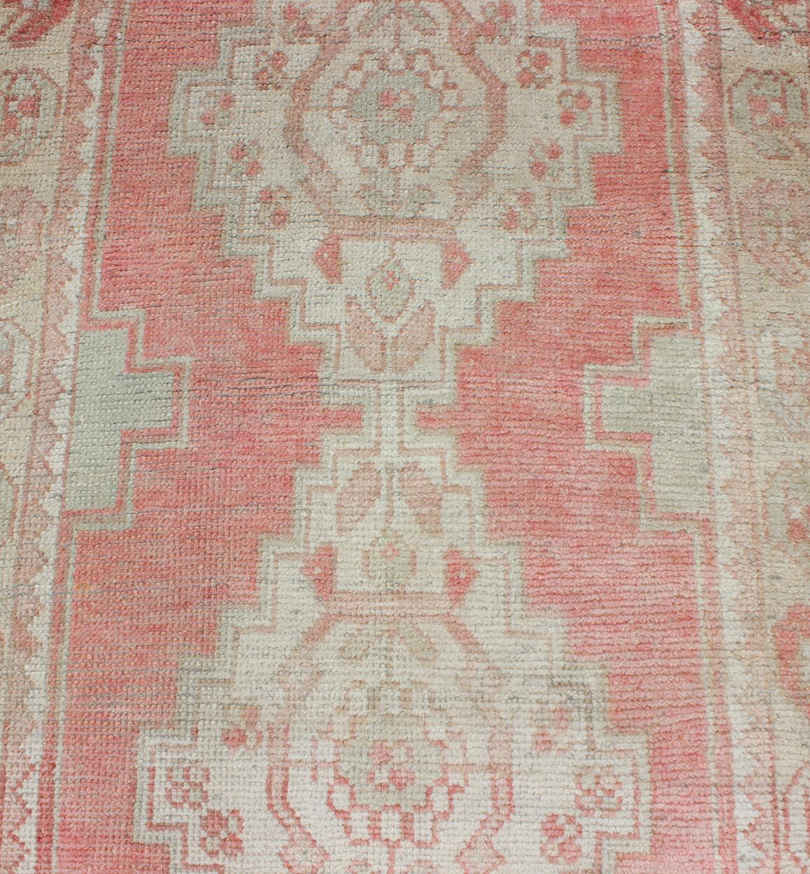 Mid-20th Century Vintage Turkish Oushak Runner with Multi-Medallion Design in Muted Red and Ivory For Sale