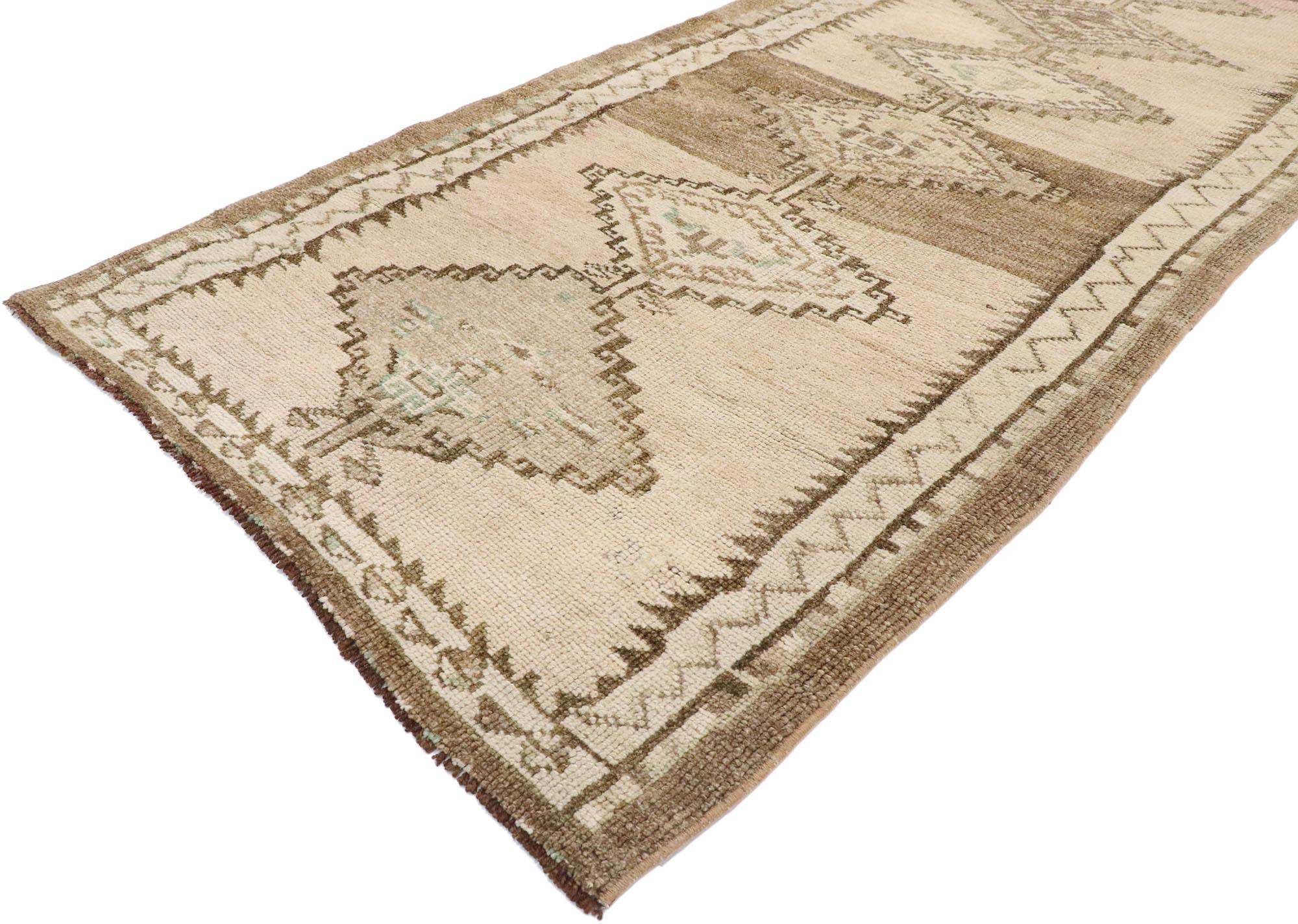 53470, vintage Turkish Oushak Runner with Neutral boho chic Tribal style. With its bold expressive design, incredible detail and texture, this hand knotted wool vintage Turkish Oushak rug is a captivating vision of woven beauty. The abrashed soft