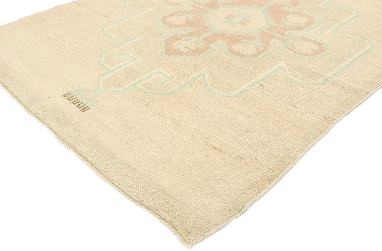 52963 vintage Turkish Oushak runner with Romantic French Country Cottage style. Striking the perfect balance of understated elegance and subtle sophistication with soft, bespoke vibes, this hand knotted wool vintage Turkish Oushak runner beautifully