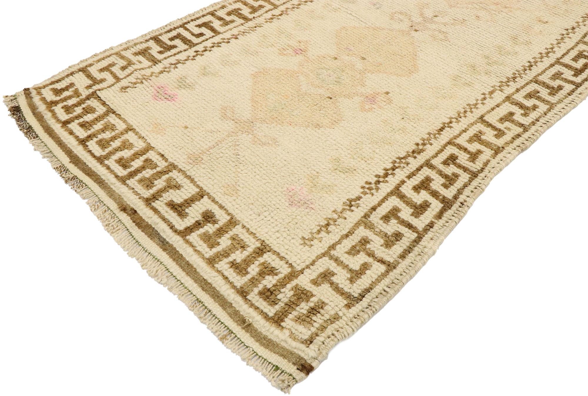 53085, vintage Turkish Oushak runner with romantic shaker boho chic cottage style. Softer yet no less striking, this hand knotted wool vintage Turkish Oushak runner beautifully showcases a barely-there geometric botanical design peeking through the