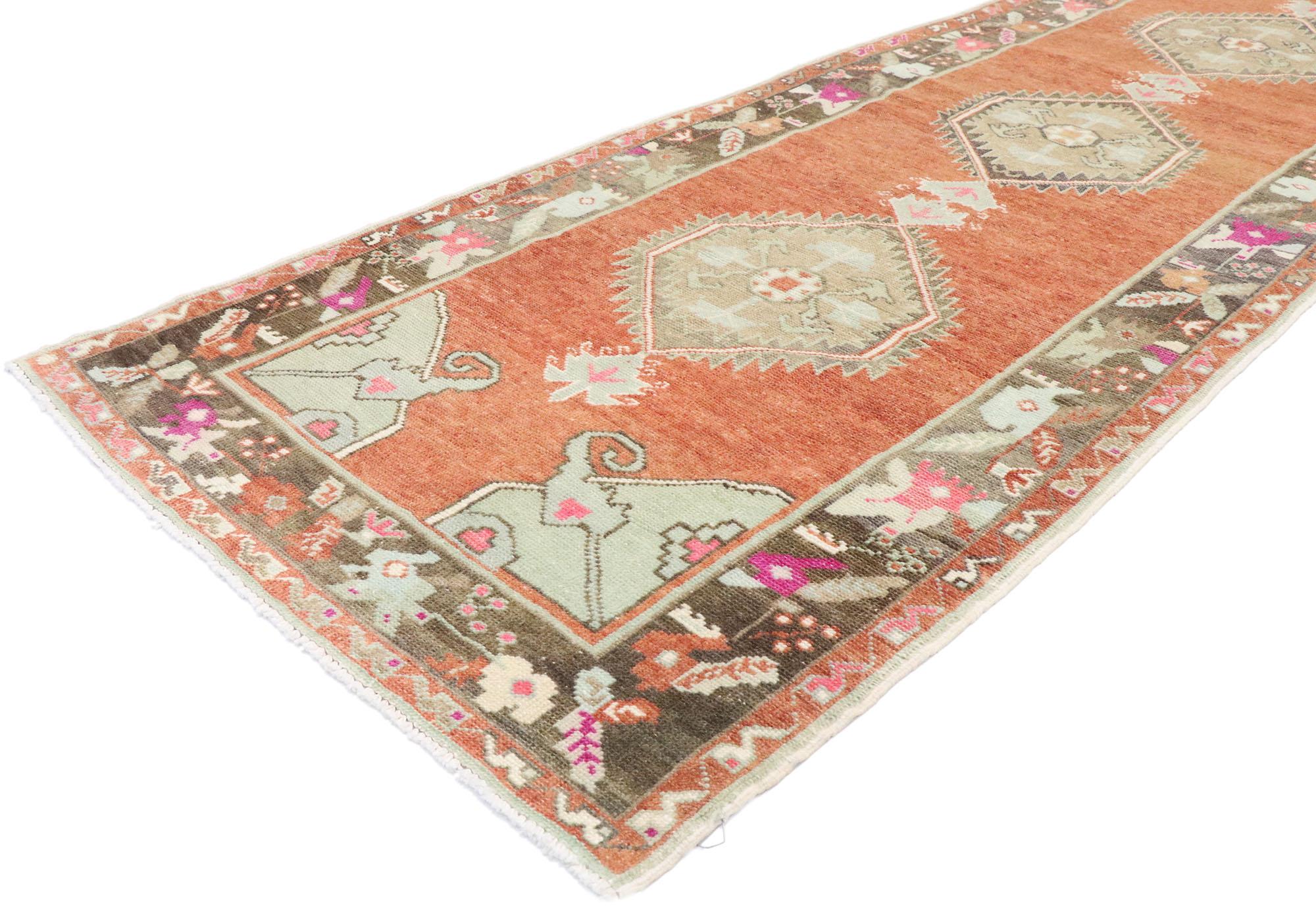 53474, vintage Turkish Oushak Runner with Rustic English Cottage style. With a timeless design and a hint of romantic connotations, this hand knotted wool vintage Turkish Oushak runner is poised to impress. The rustic reddish hued field features