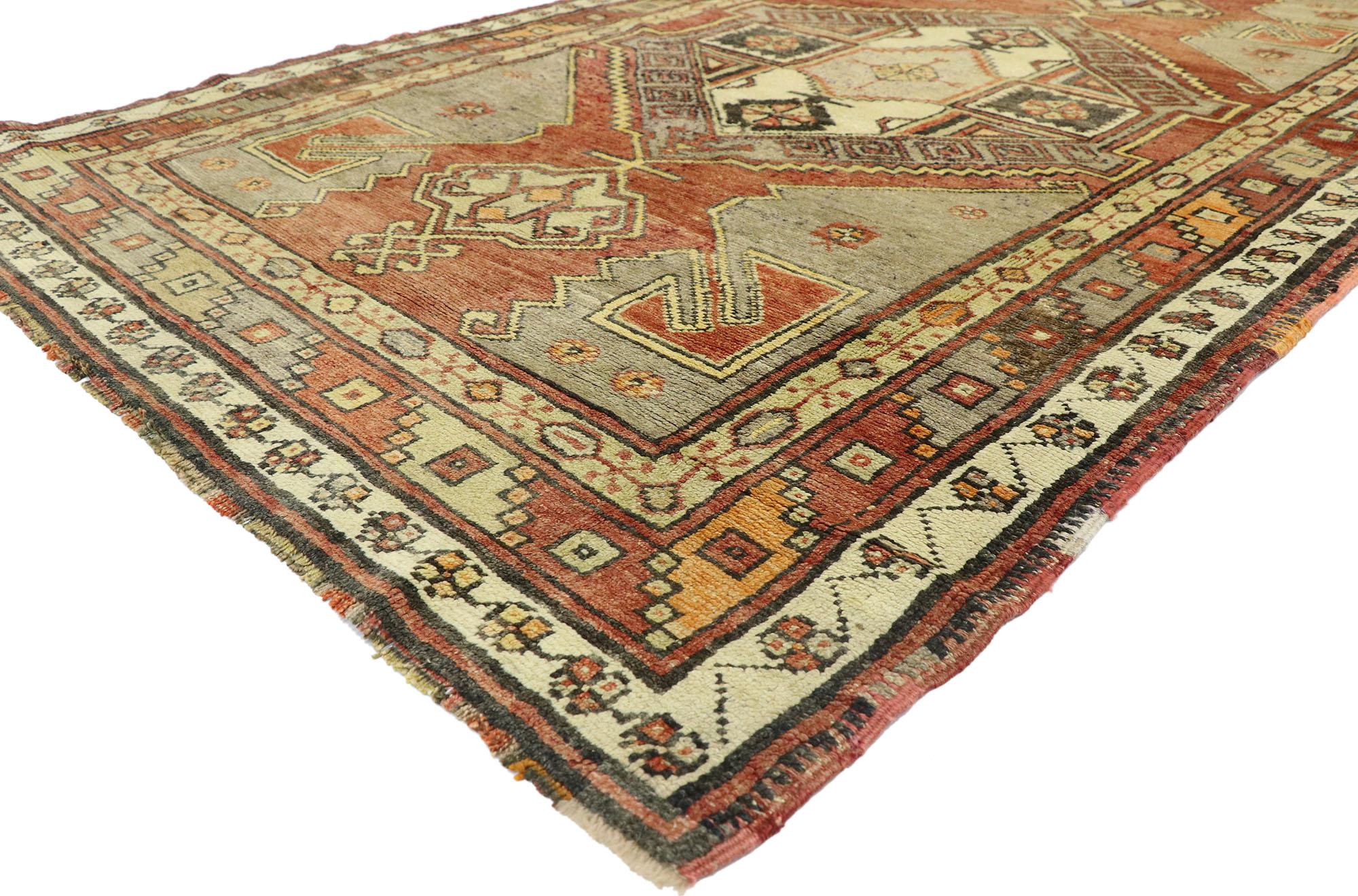 50407 vintage Turkish Oushak runner with Spanish Revival style, wide hallway runner. This hand knotted wool vintage Turkish Oushak runner features two stepped hexagonal medallions with anchor pendants floating on an abrashed terracotta field. Each