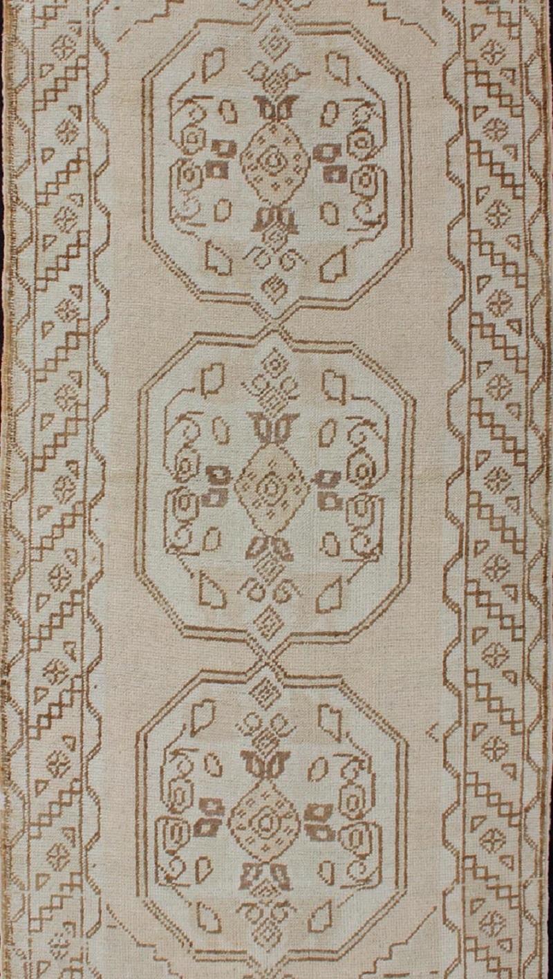 Hand-Knotted Vintage Turkish Oushak Runner with Stylized Three Medallion Design For Sale