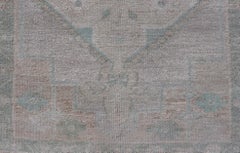 Vintage Turkish Oushak Runner with Subdued Geometric Medallions in Light Tones