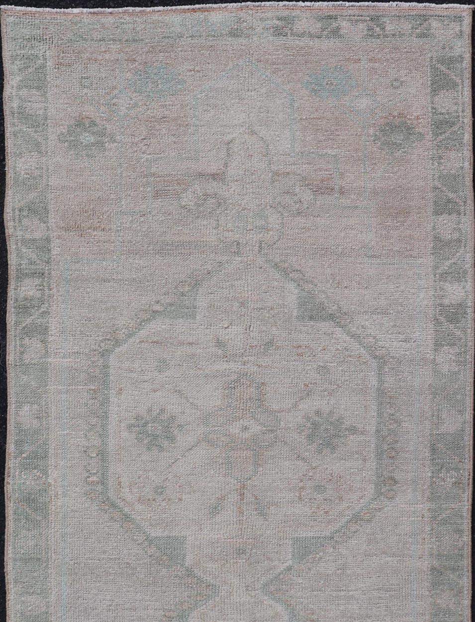 Vintage Turkish Oushak Runner with Subdued Geometric Medallions in Light Tones In Good Condition For Sale In Atlanta, GA