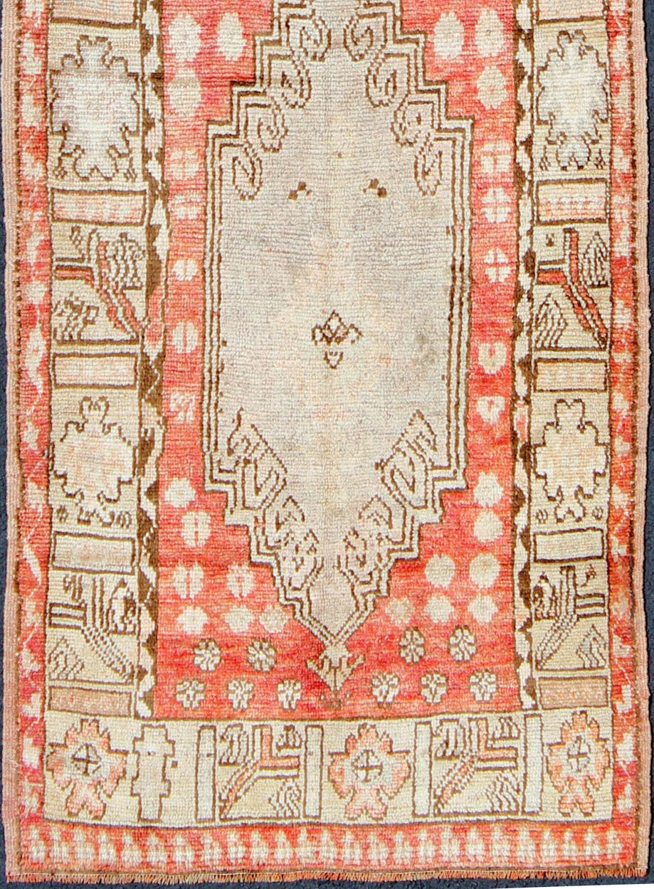 Vintage Oushak Runner from Turkey with Vertical Dual Medallion Tribal Geometric Design in Various Tones, rug en-165008, country of origin / type: Turkey / Oushak, circa 1940.

This beautiful vintage Oushak runner from 1940s Turkey features a