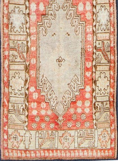 Vintage Turkish Oushak Runner with Soft Red Field and Pale Ivory Medallions