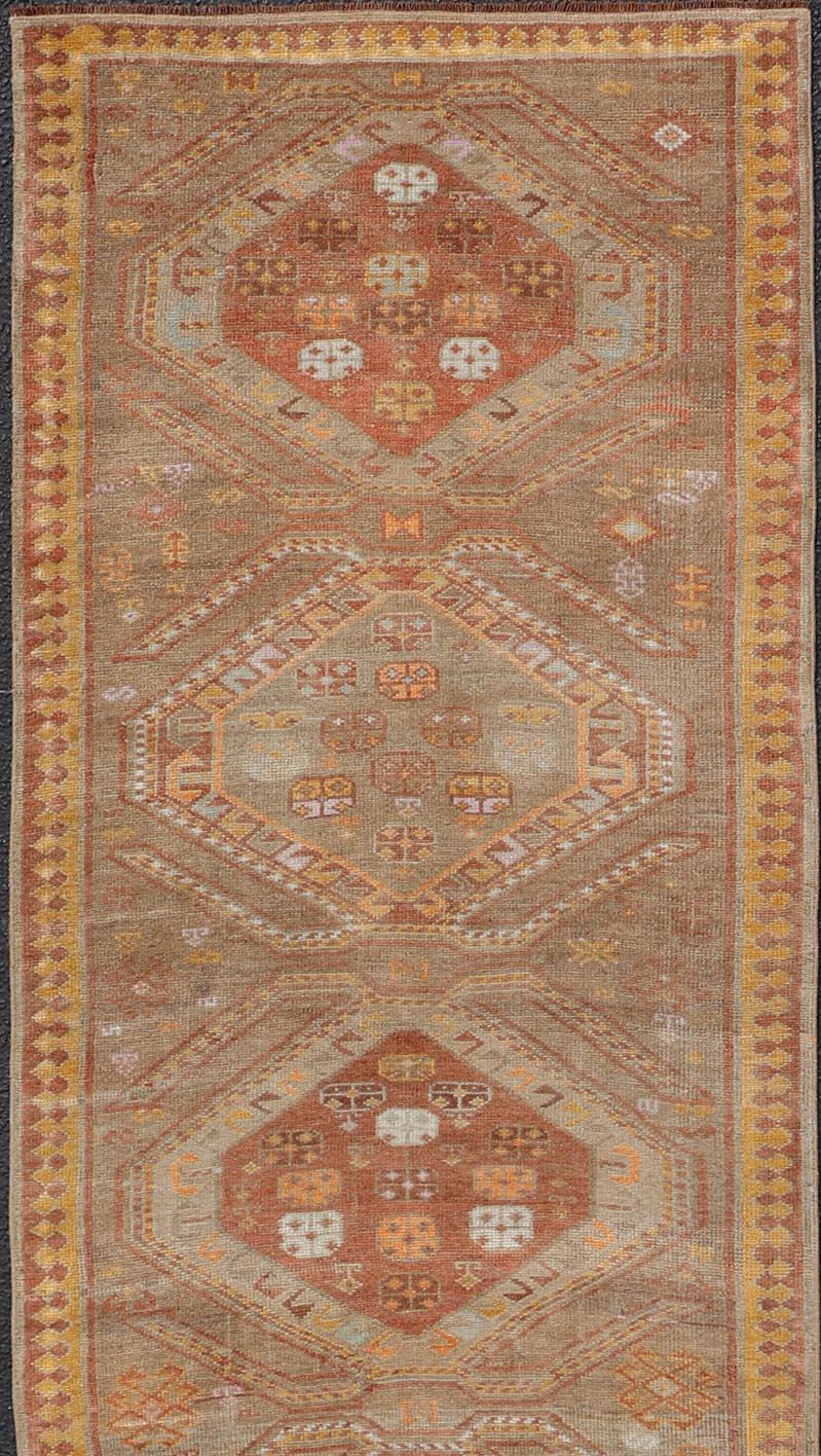 Hand-Knotted Vintage Turkish Oushak Runner with Tribal Medallions in Brown's, Yellow, and Red For Sale