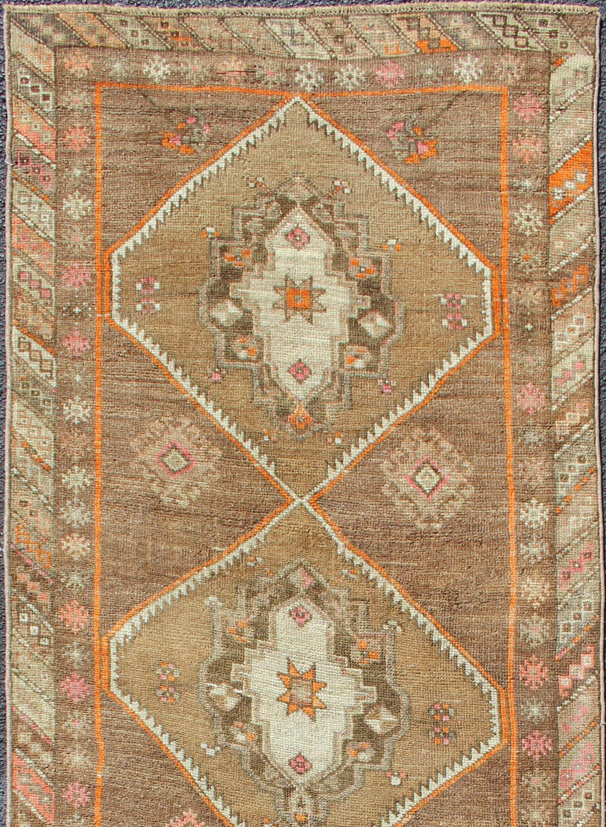 Vintage Turkish Oushak runner with floral medallions, Keivan Woven Arts / rug en-140350, country of origin / type: Turkey / Oushak, circa 1940.

This vintage Oushak runner features a unique blend of cheerful colors and an intricately beautiful