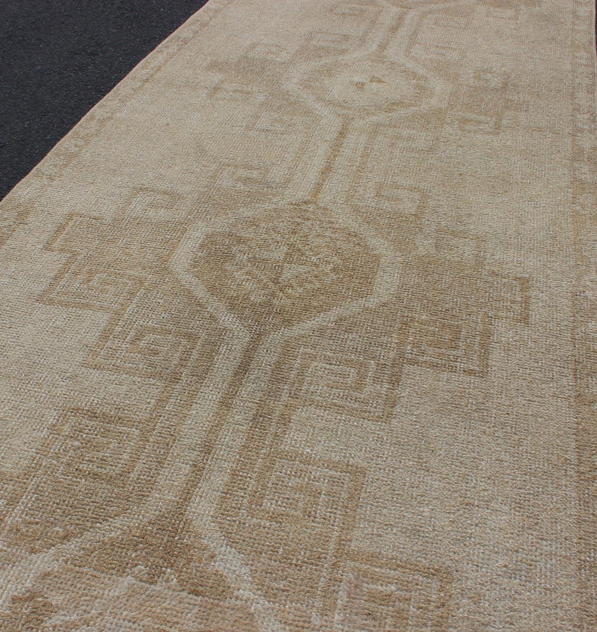 20th Century Vintage Turkish Oushak Runner with Tribal Medallions in Earthy Tones For Sale
