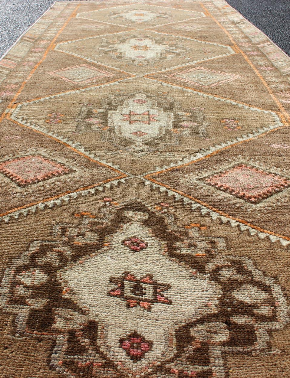 Wool Vintage Turkish Oushak Runner with Tribal Medallions in Earthy Tones For Sale