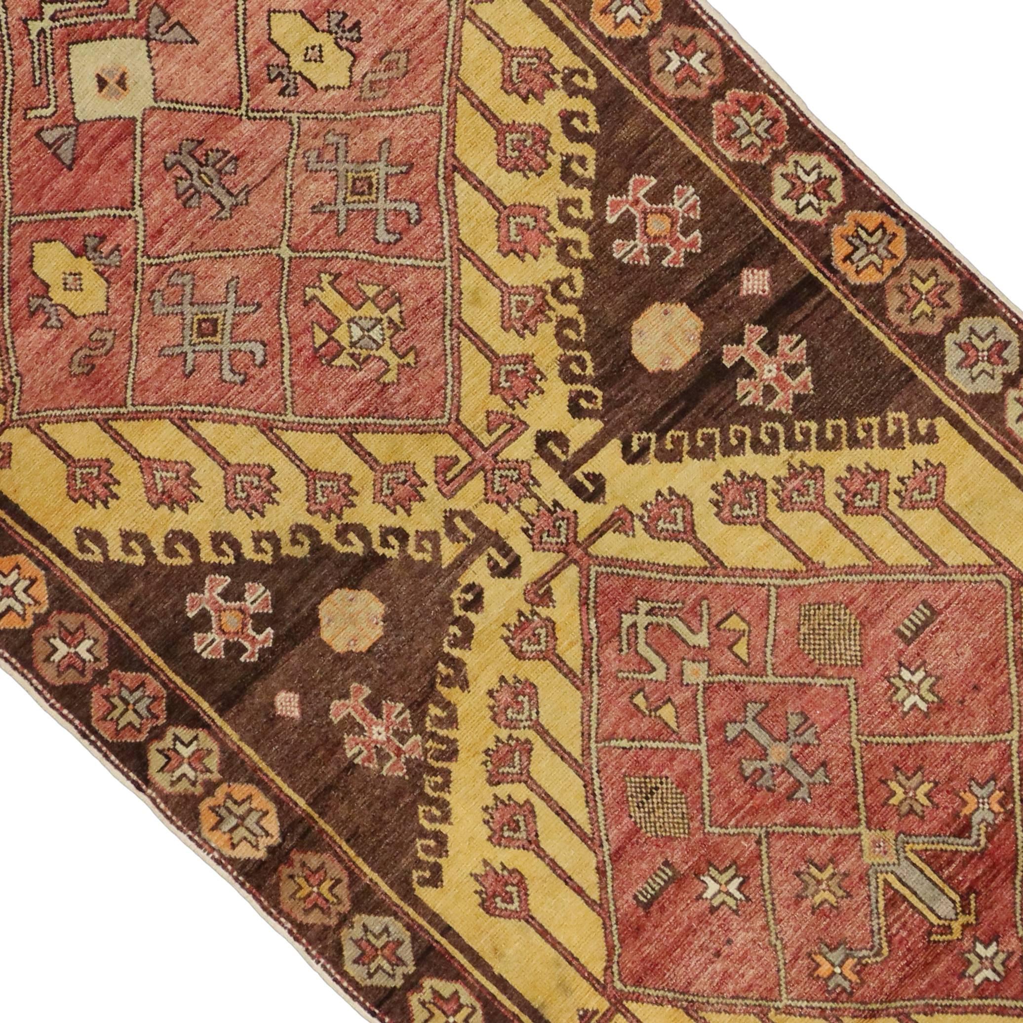 74046, vintage Turkish Oushak runner with tribal style, hallway runner. This hand-knotted wool vintage Turkish Oushak runner features a double amulet inspired by the Yomut (Yomud). The abrashed brick red diamond amulets are divided into compartments