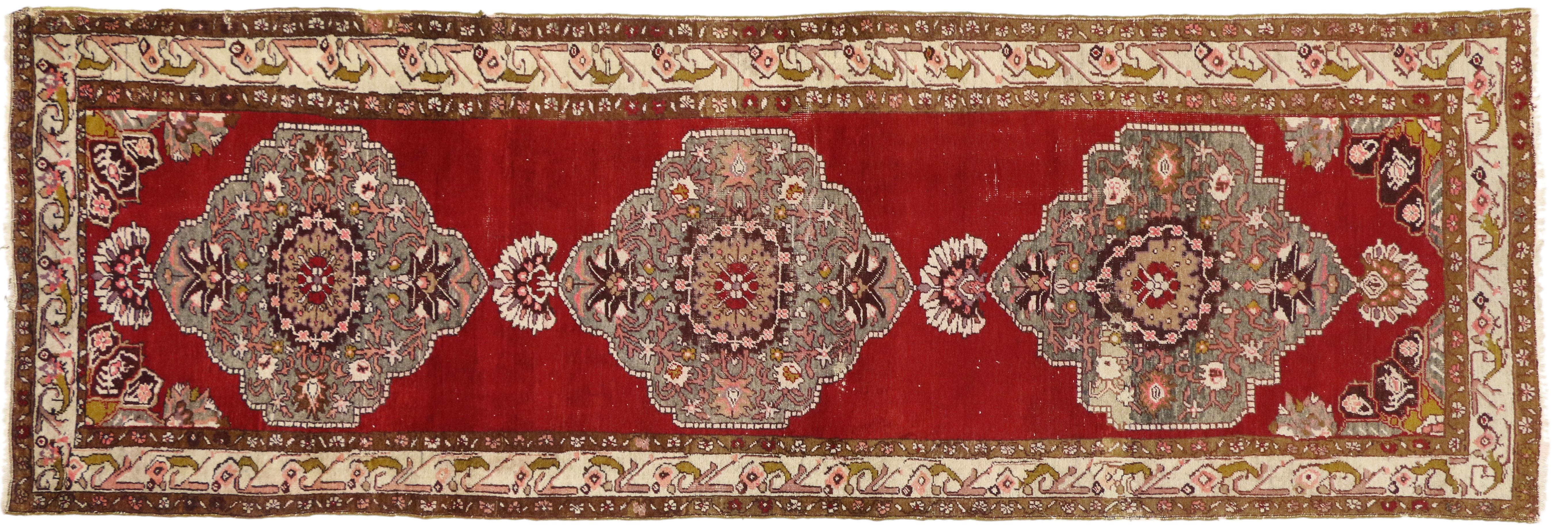 73636 Vintage Turkish Oushak Runner with Tribal Style, Hallway Runner. Vintage hand-knotted wool Turkish Oushak runner featuring three large geometric medallions in an open red abrashed field surrounded by a traditional border. Perfect for a