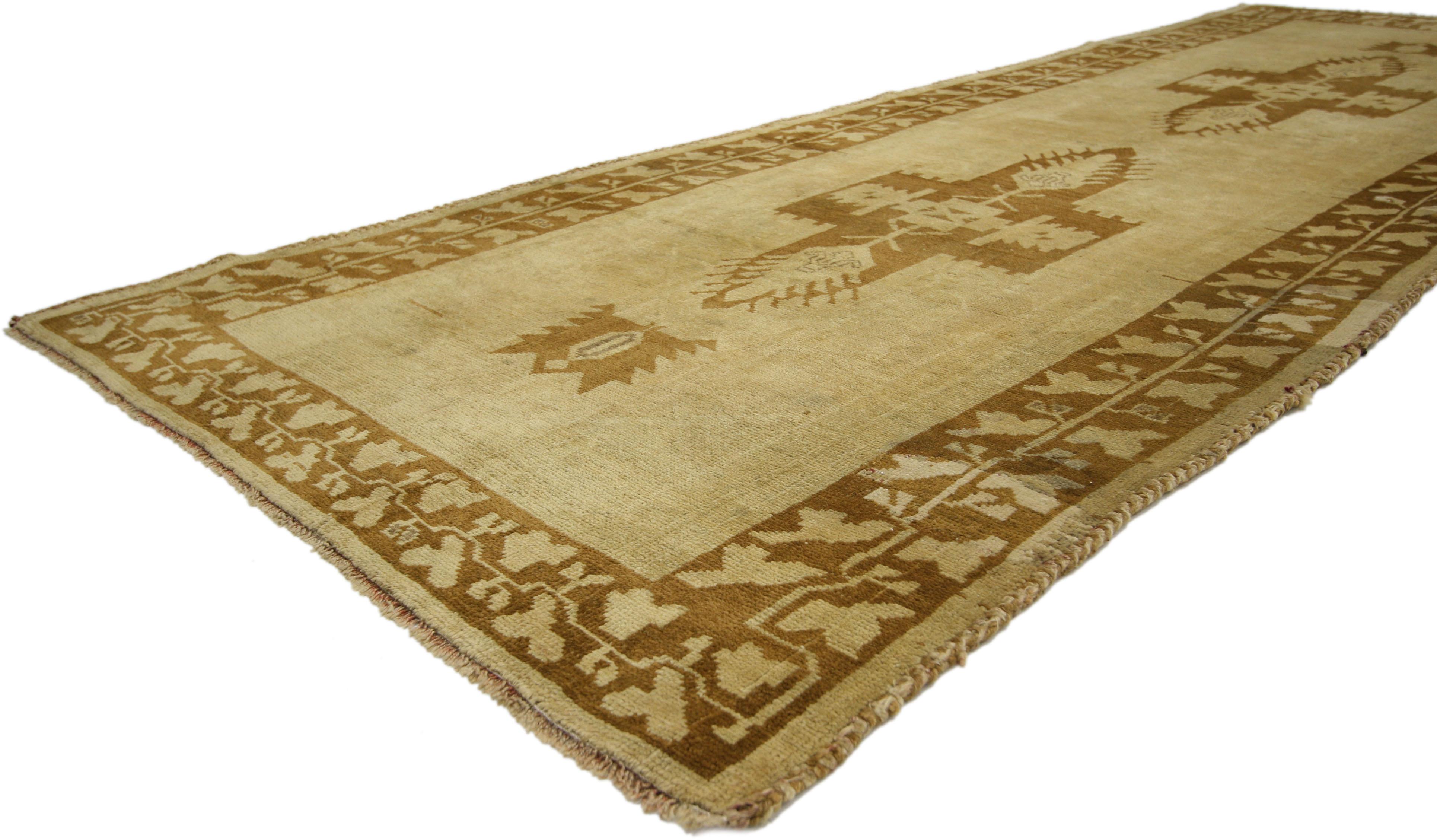 50023 Vintage Turkish Oushak Runner with Warm, Neutral Colors, Hallway Runner. Hand-knotted from soft, silky wool and featuring low-contrast warm colors, this vintage Turkish Oushak carpet runner is easily integrated into modern and Minimalist homes