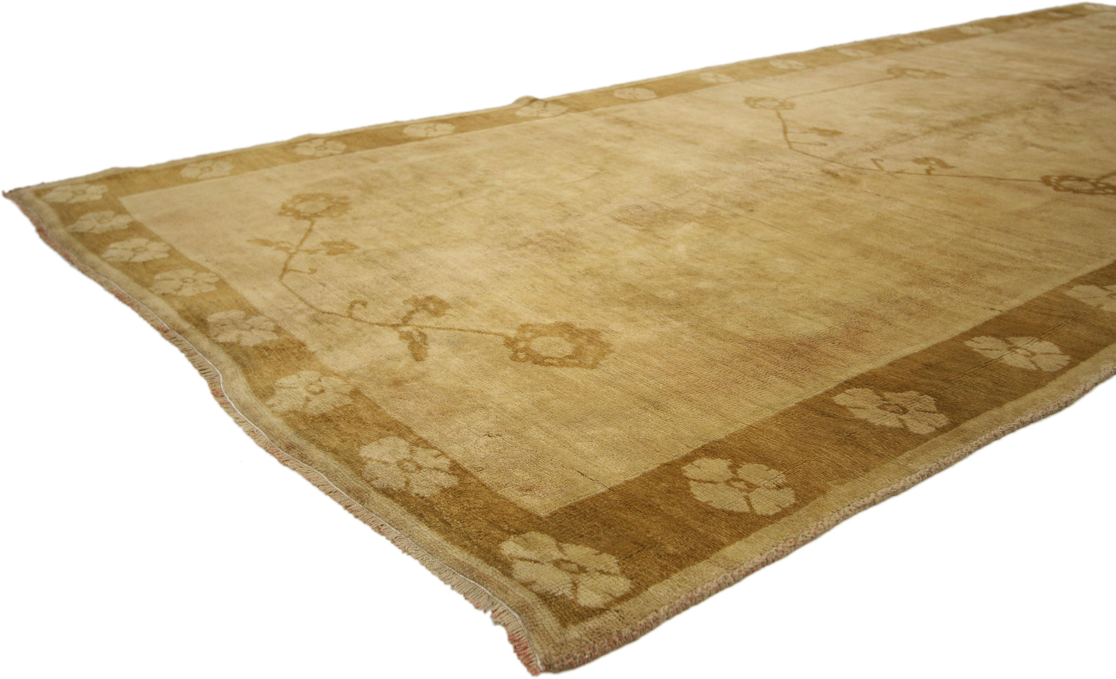 50435 Vintage Turkish Oushak Runner, Warm, Neutral Color Hallway Runner, 05'00 x 11'05. This hand-knotted wool vintage Turkish Oushak carpet runner features a traditional modern style in warm, neutral colors. A simple centre medallion and two