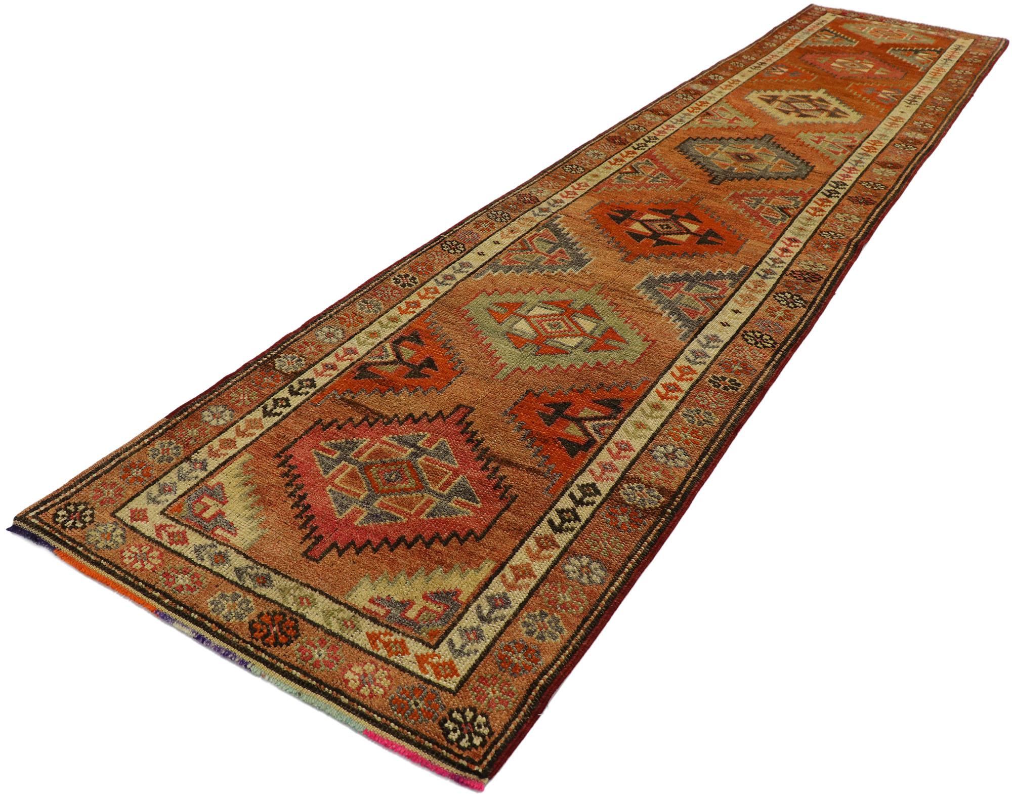 53226, vintage Turkish Oushak runner with warm Santa Fe desert tribal style. With vibrant hues and warm earth-tones combined with a bold geometric form, this hand knotted wool vintage Turkish Oushak runner manages to beautifully meld with modern,