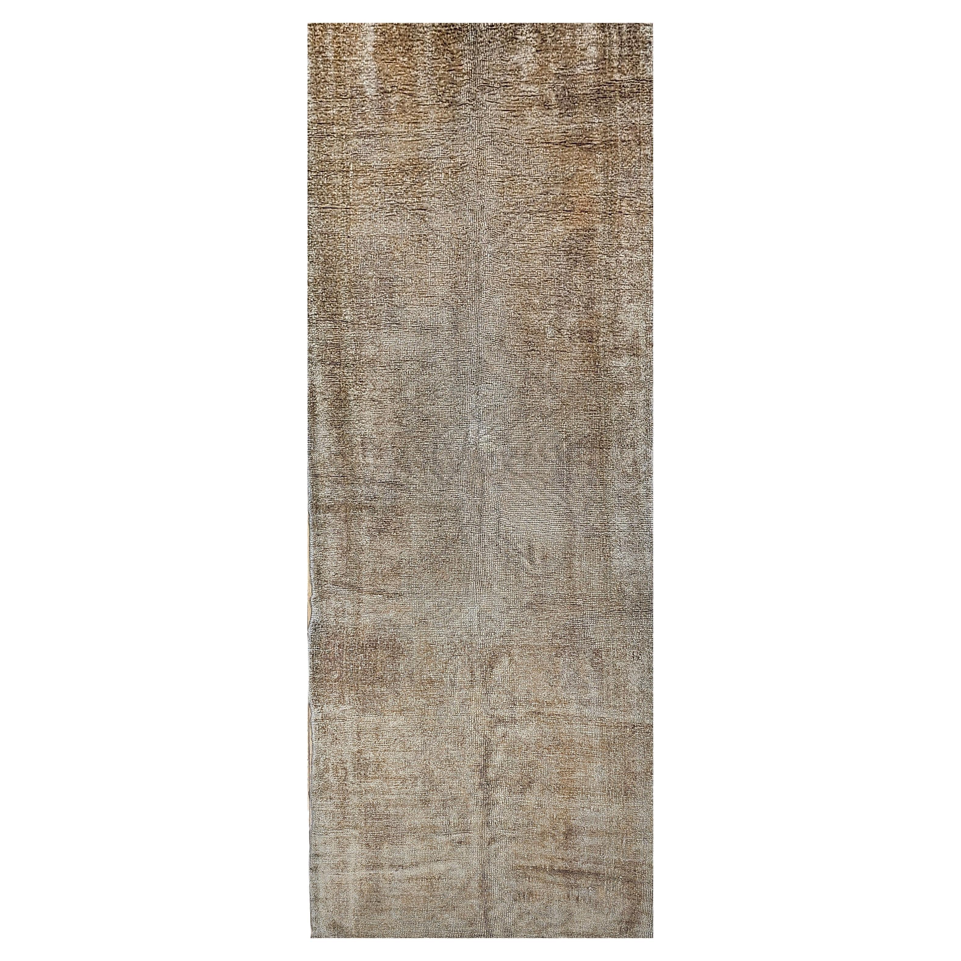 Simple but beautiful best describes this light taupe color Turkish Oushak wide runner from the early 1900s.  The Oushak runner has a muted color style.  Showcasing timeless elegance in a demure color palette this hand-knotted wool vintage Turkish