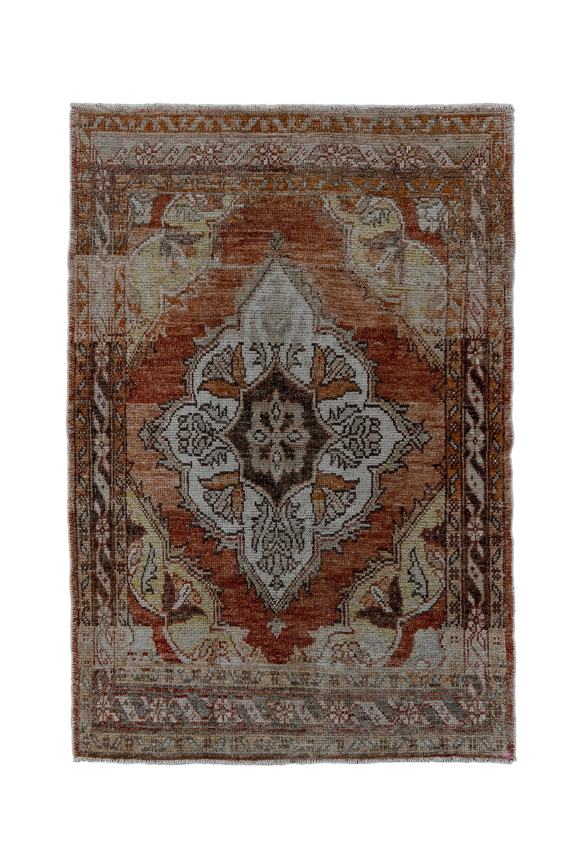 The strong abrashed ruby red field hosts a giant lobed ecru medallion with eight internally radiating flowers. Straw corners with similar blossoms. Abrashed slate border with rosettes and stretched S shapes. Cotton warp, coarse weave.

Rug