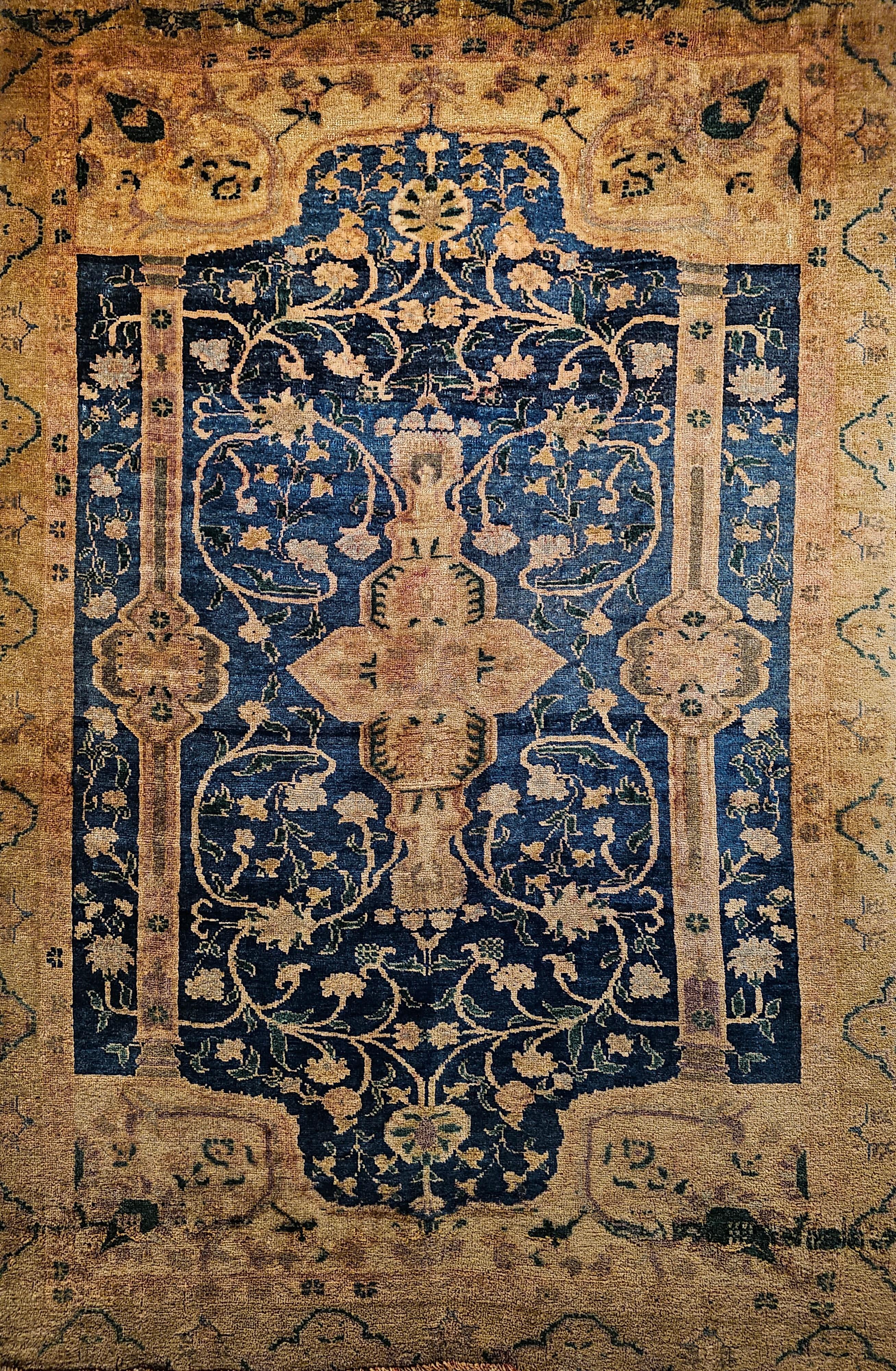 A vintage Turkish Oushak area rug with a botanical pattern in abrash French blue, green, and ivory colors from the early 1900s.  The rug has a beautiful abrash royal blue field color with a cream color border and a central medallion.  There are two