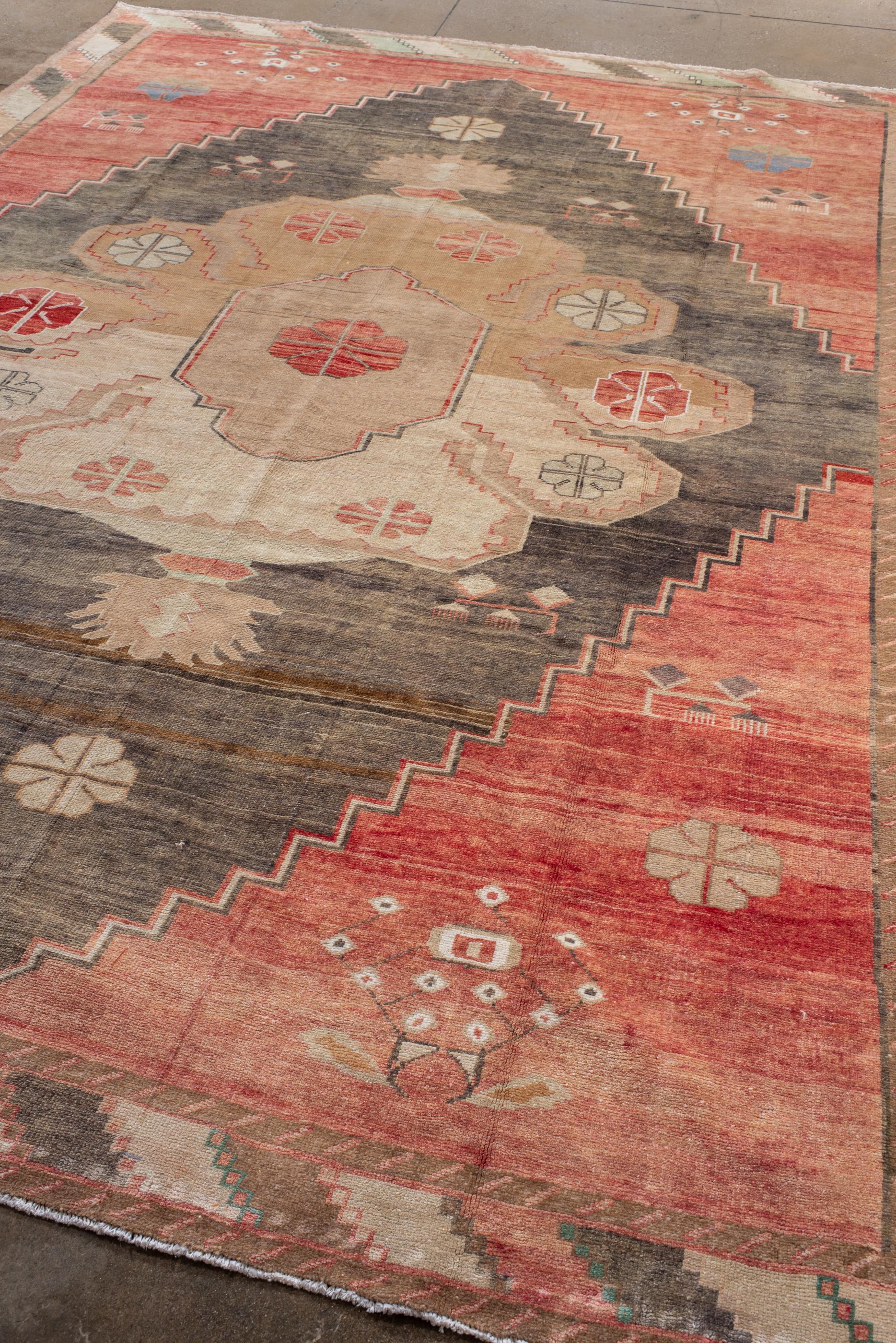 Hand-Knotted Vintage Turkish Oushak with Red Field and Striped Border For Sale