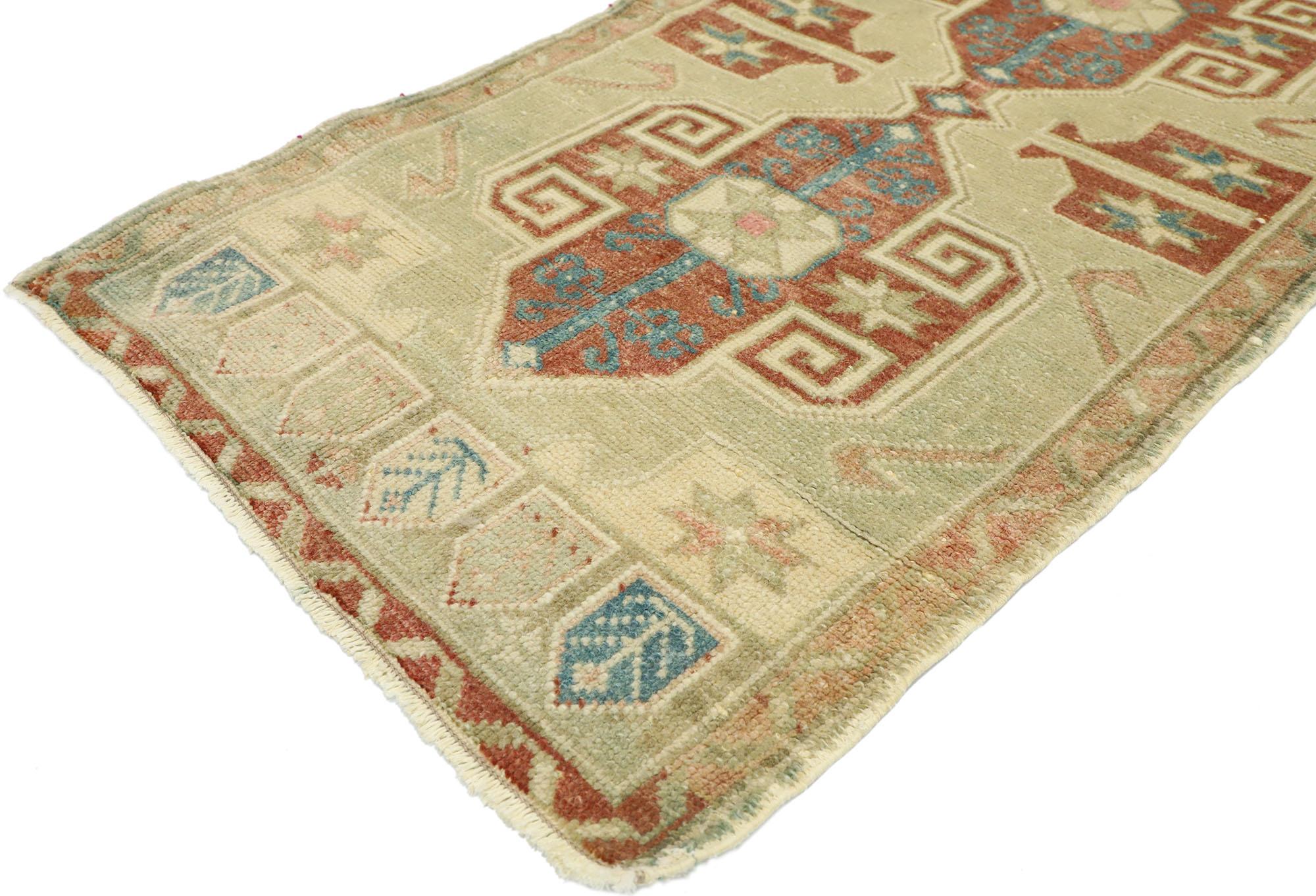 52696 vintage Turkish Oushak Yastik scatter rug, small accent rug. This hand knotted wool vintage features two central medallions patterned with ram's Horn, hands on hips, eight-point stars, and latch-hooks on an abrashed open field. It is enclosed