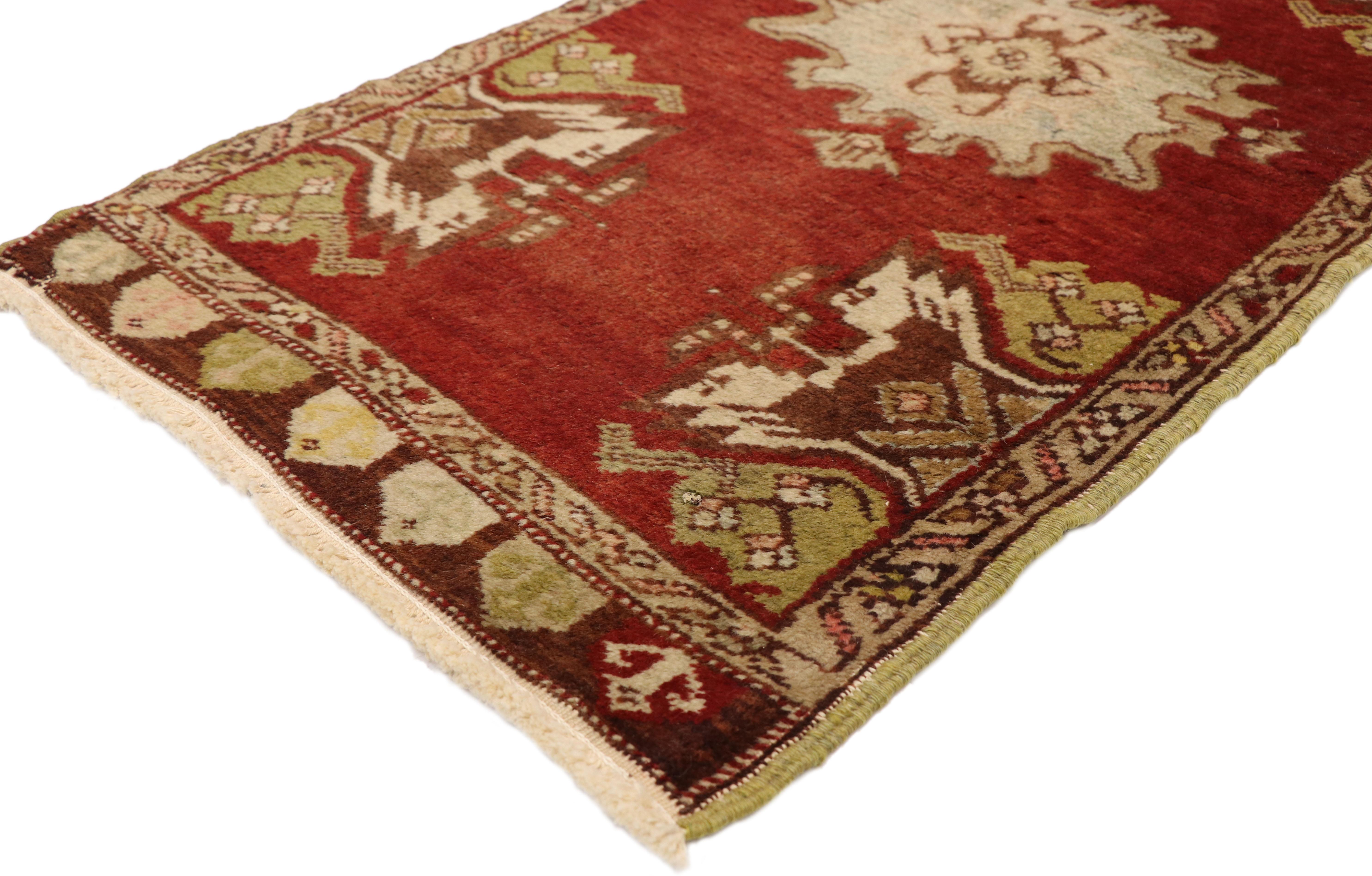 51217, vintage Turkish Oushak Yastik Scatter rug, small accent rug 01'09 x 03'07. This hand knotted wool vintage Turkish Oushak Yastik scatter rug features a central medallion patterned with a geometric botanical scene flanked with four ambiguous