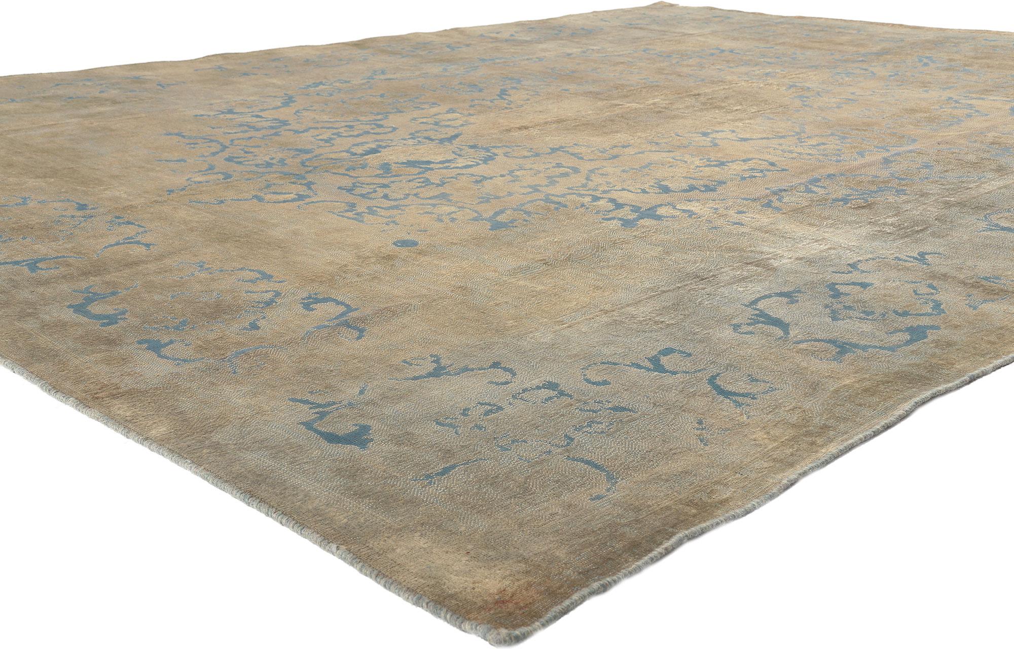 60620 Vintage Turkish Overdyed Rug, 09'07 x 12'06. 
Crafted with meticulous attention to detail, this hand knotted wool vintage Turkish overdyed rug seamlessly integrates a stylish aesthetic with subtle French Country influences, coupled with