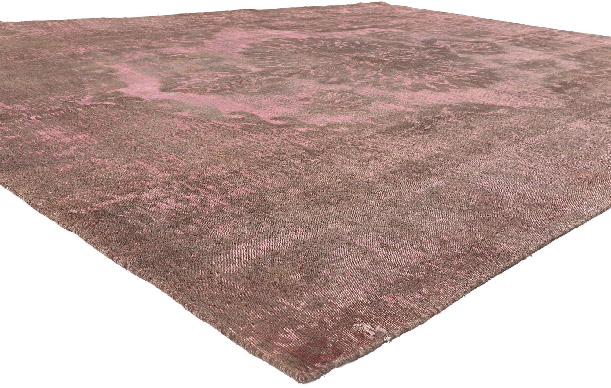 Boho Chic meets the softer side of Modern Industrial style in this hand knotted wool vintage Turkish overdyed rug. The decorative detailing and bohemian color palette in this piece deliver a sophisticated chic aesthetic with romantic connotations.