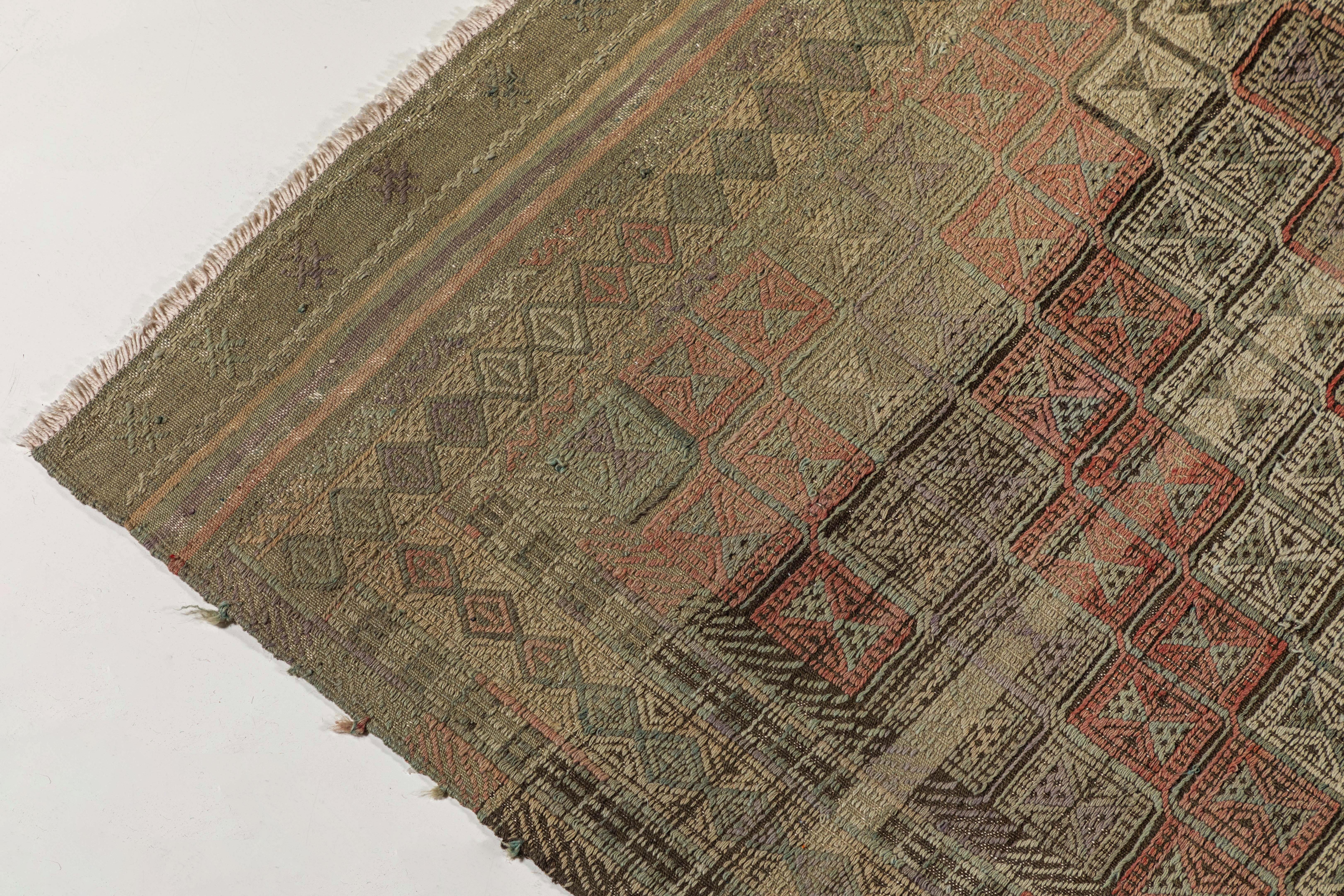 Vintage Turkish Ozdemir flat-weave rug with grey and mauve accents.