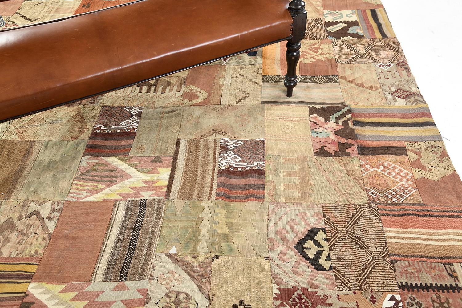 Displaying a charming and captivating impression, this Vintage Turkish Patchwork Kilim is an embodiment of modern rustic preppy style. The patchwork pattern is composed of intricately designed variegated irregular motifs, squares, and rectangles.