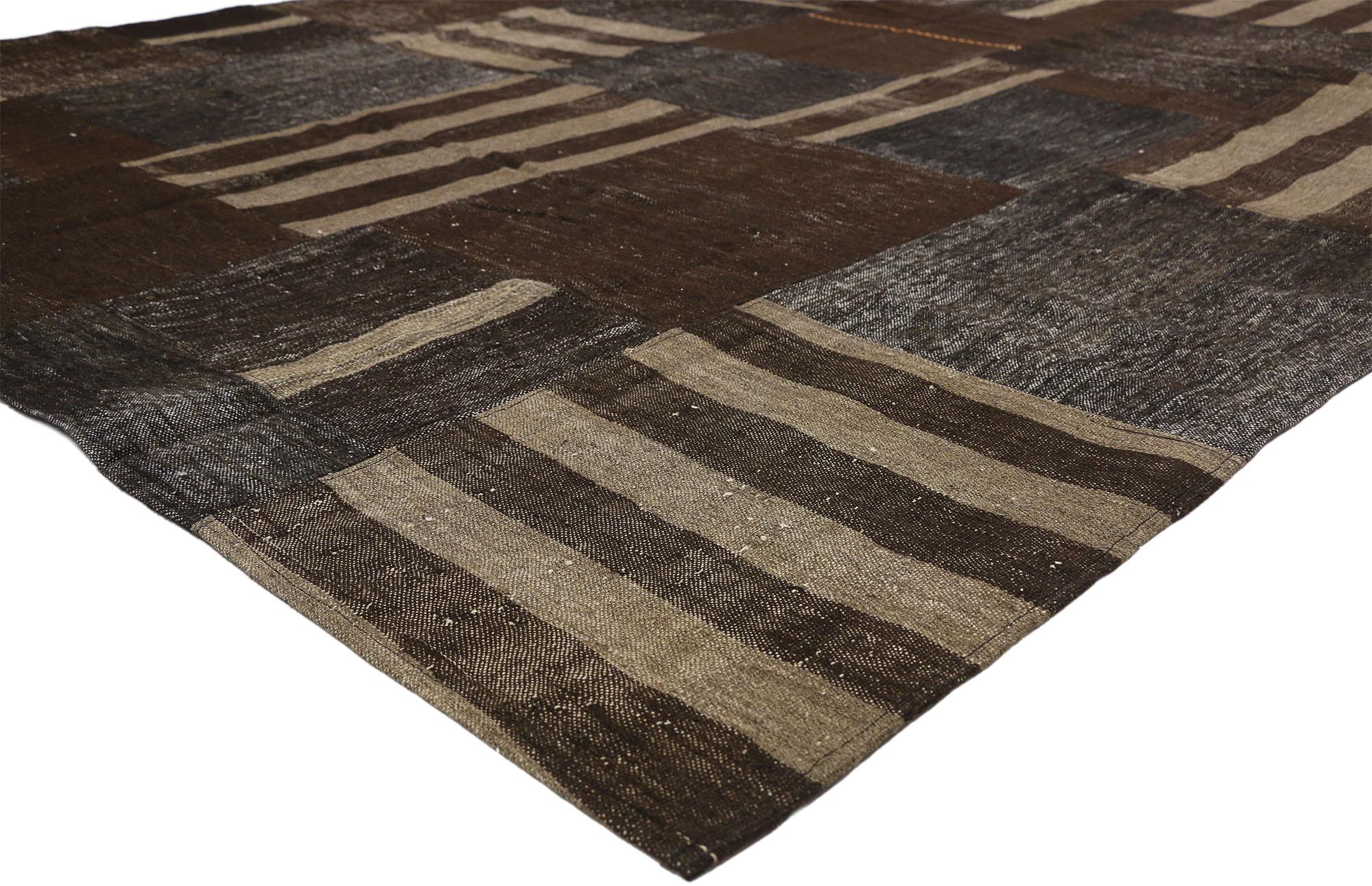 51065 Vintage Turkish Patchwork Kilim Rug, 08'06 X 10'07.  Emanating masculine appeal and Wabi-Sabi style, this vintage Turkish patchwork rug is a captivating vision of woven beauty. The geometric design and earthy colorway woven into this piece