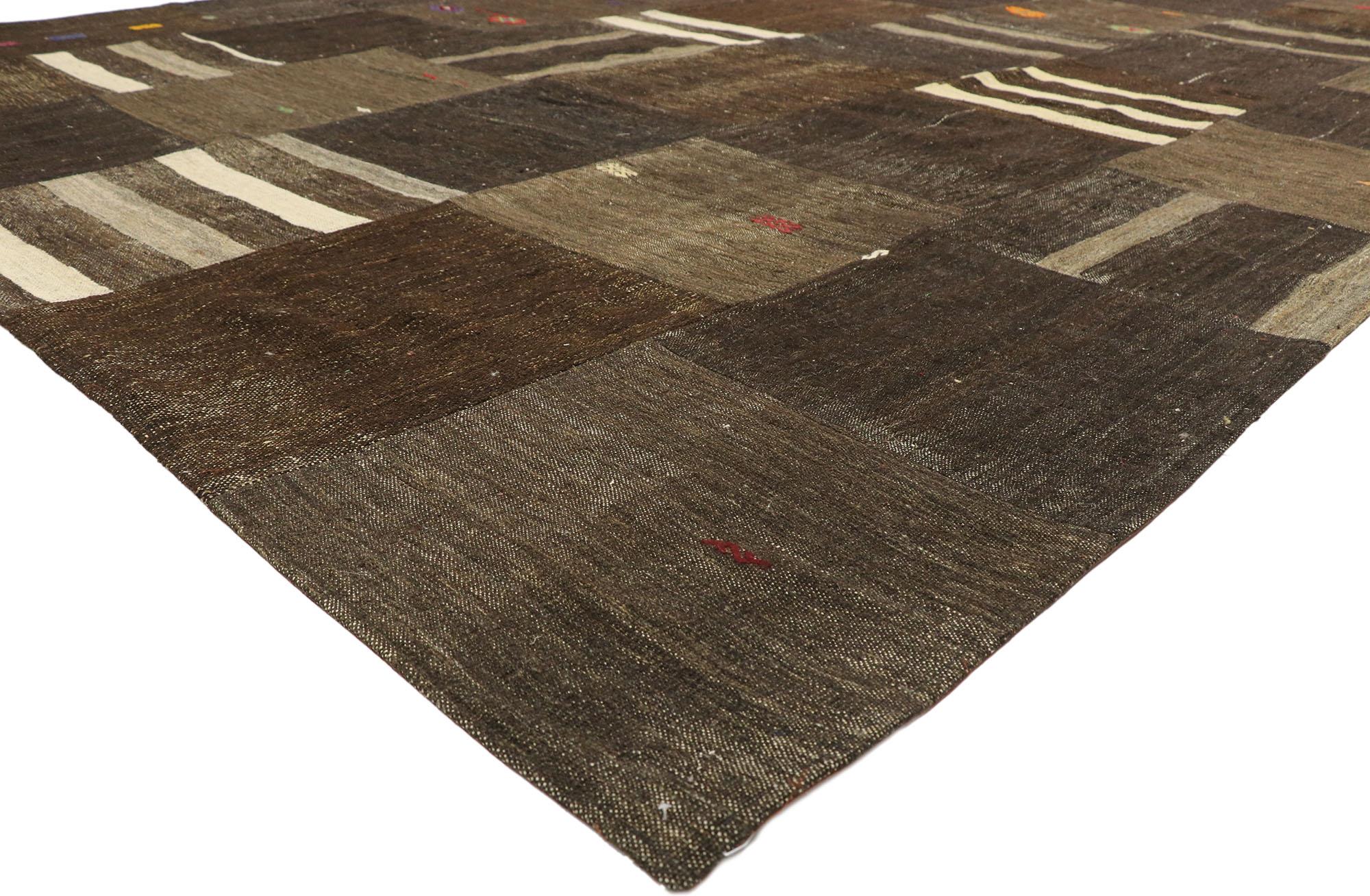 ​52132 Vintage Turkish Patchwork Rug with Masculine Preppy Style 09'09 x 14'00. Displaying a charming masculine appeal and the embodiment of ivy league style, this hand-woven vintage Turkish patchwork rug is a captivating vision of woven beauty​.