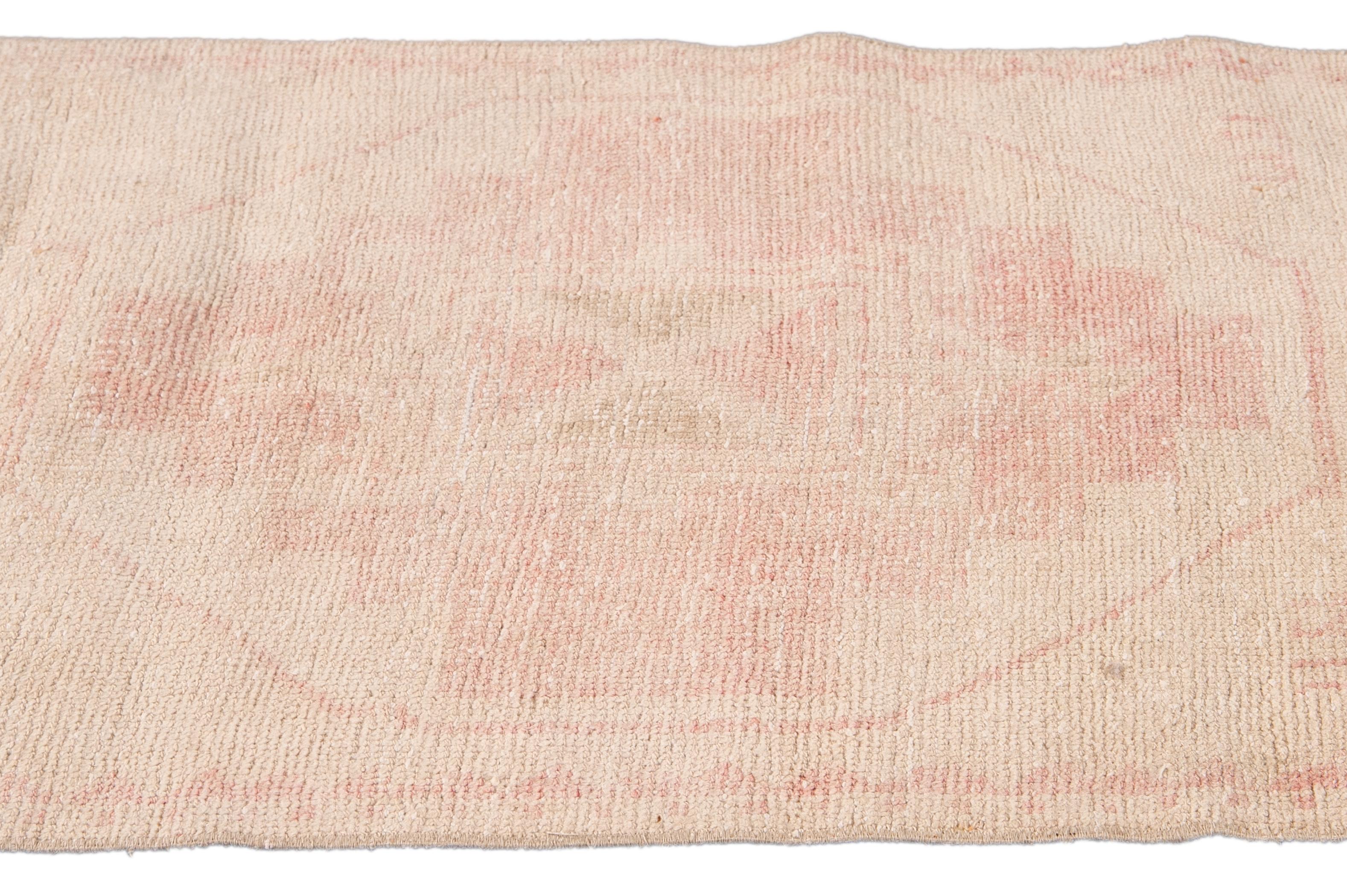 20th Century Vintage Turkish Pink and Beige Handmade Tribal Wool Runner For Sale