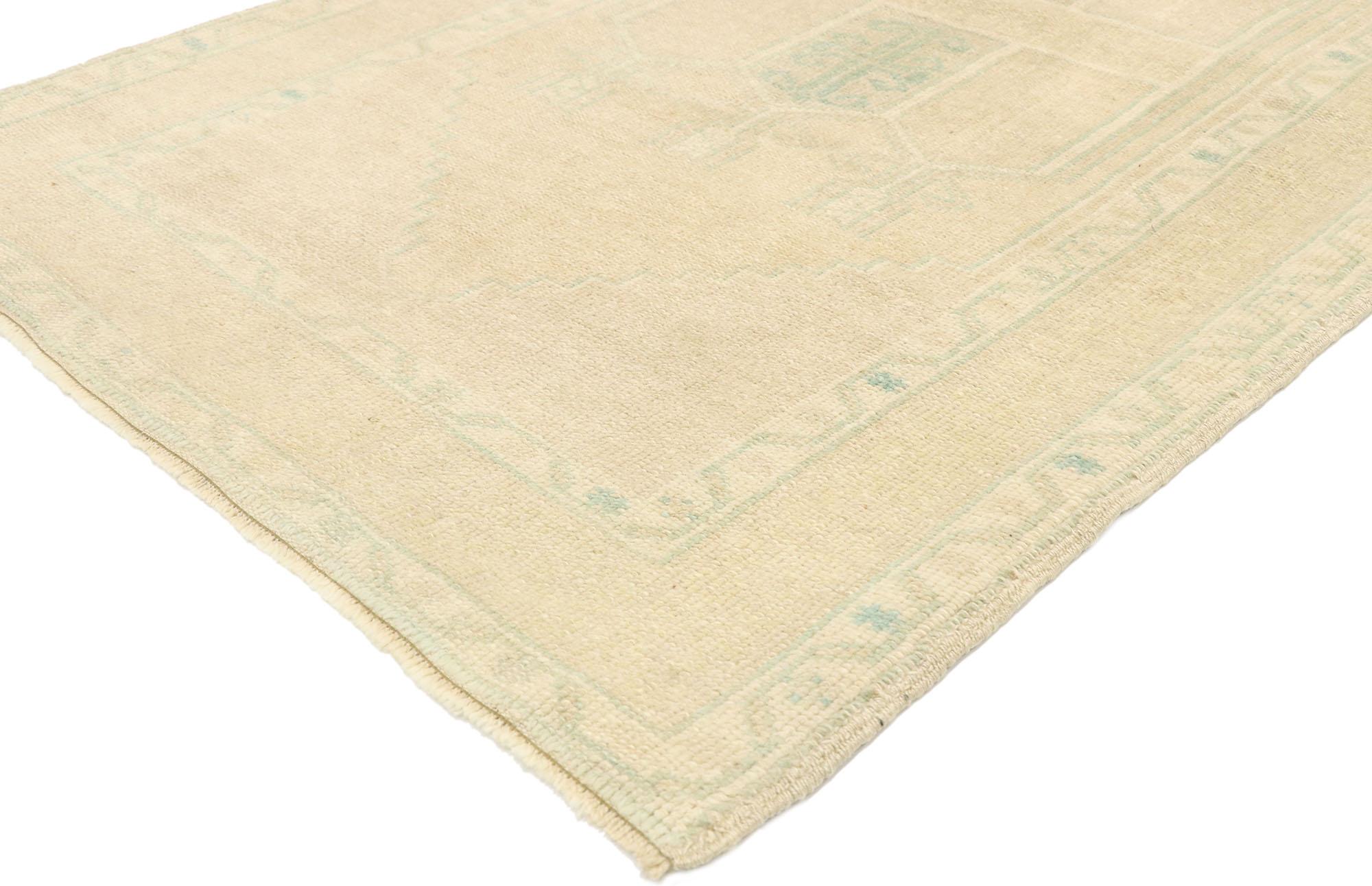 52968 vintage Turkish Prayer rug, Anatolian Double Mihrab carpet. Effortless beauty and soft, bespoke vibes meet minimalist French Country Cottage style in this hand knotted wool vintage Turkish prayer rug. The khaki-beige antique washed field