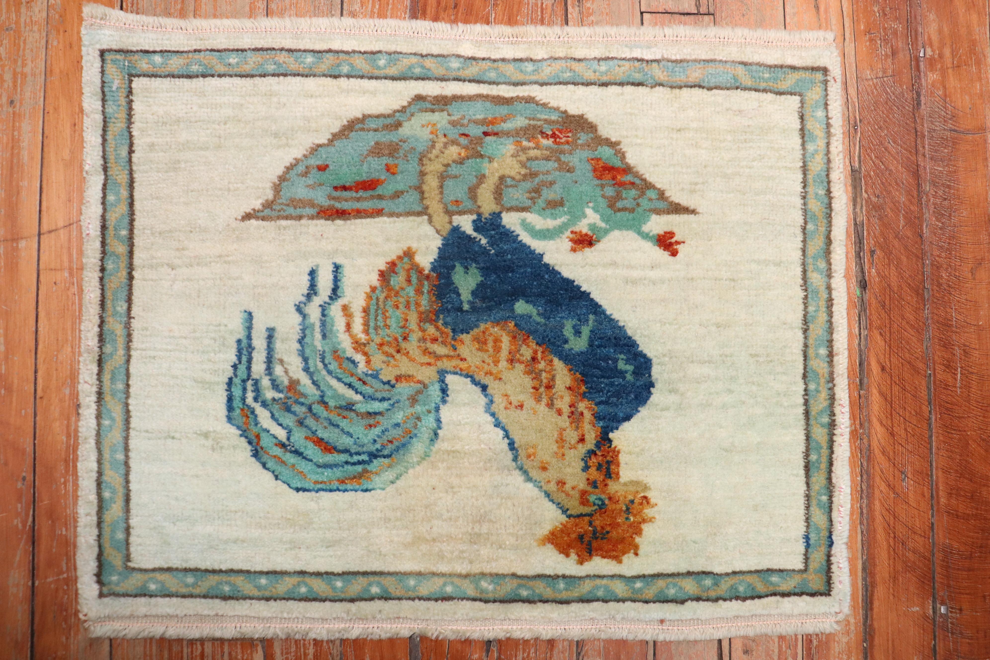 Vintage Turkish mat size rug depicting a rooster on an ivory field. 

Measures: 1'6