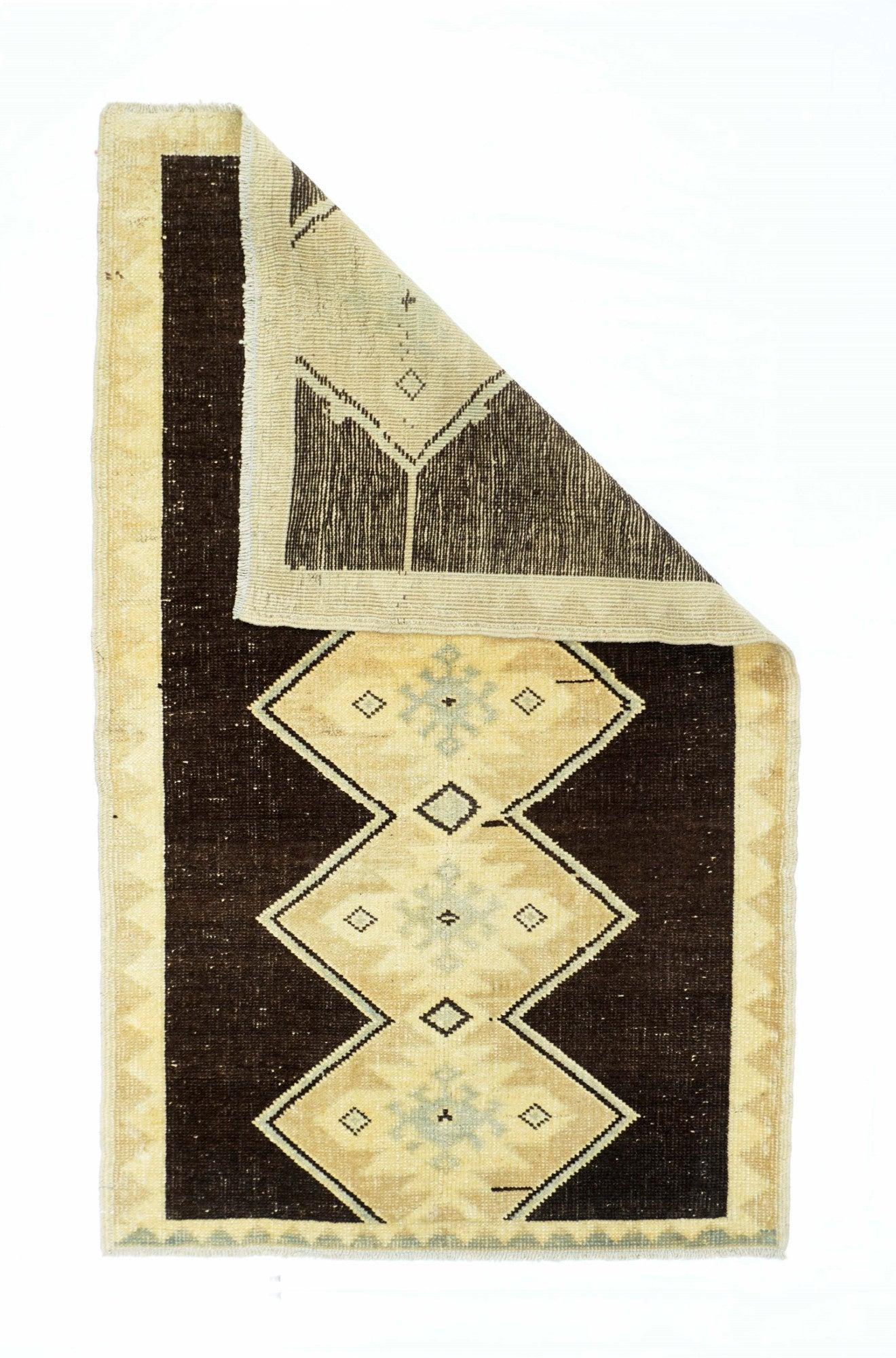 Vintage Turkish Rug 2'10'' x 4'10''. Three lonely ecru quadrupeds alternately face left and right on the abrashed and partially striated red open field. Superbly abrashed plain moss green border shows partial moire patterns. Qashghai nomadic work