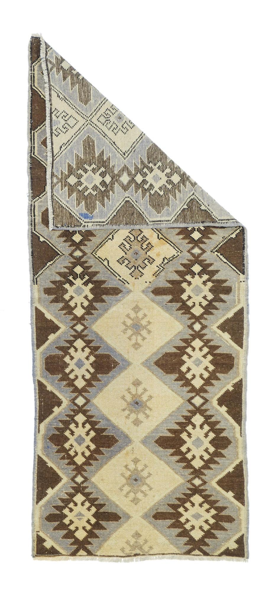 Vintage Turkish Rug 2'6'' x 6'4''. The carpets, scatters, runners, long rugs and bags of the towns, villages and tribes of Anatolia, including: Oushak, Ghiordes, Kula, Ladik, Hereke, Konya, Melas, Bergama, Sivas, Kayseri and Yuruk. Enormous range of