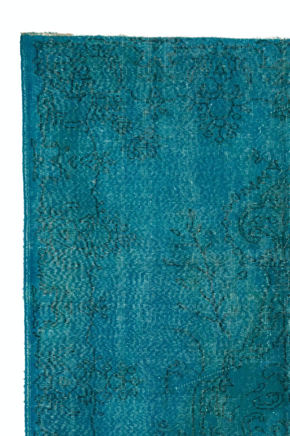 A vintage Turkish area rug re-dyed in turquoise blue color. Measures: 6 x 9.4 Ft
Finely hand knotted, low wool pile on cotton foundation. Deep washed.
Sturdy and can be used on a high traffic area, suitable for both residential and commercial