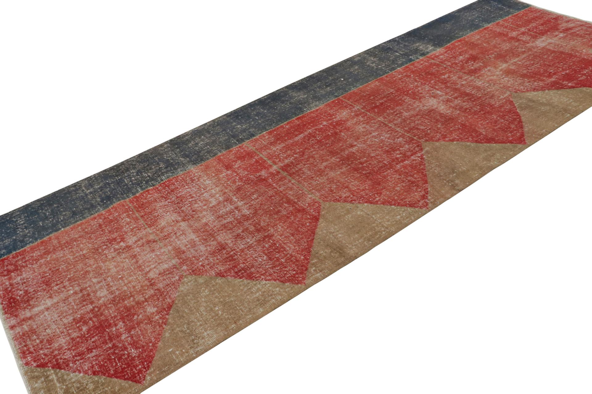 Hand Knotted in wool, this distressed vintage 4x11 Turkish rug, which is inspired by Saf rugs, a particular kind of prayer rug, features a brick red field and geometric patterns in hues of bronze and black.  

On the Design: 

Connoisseurs will