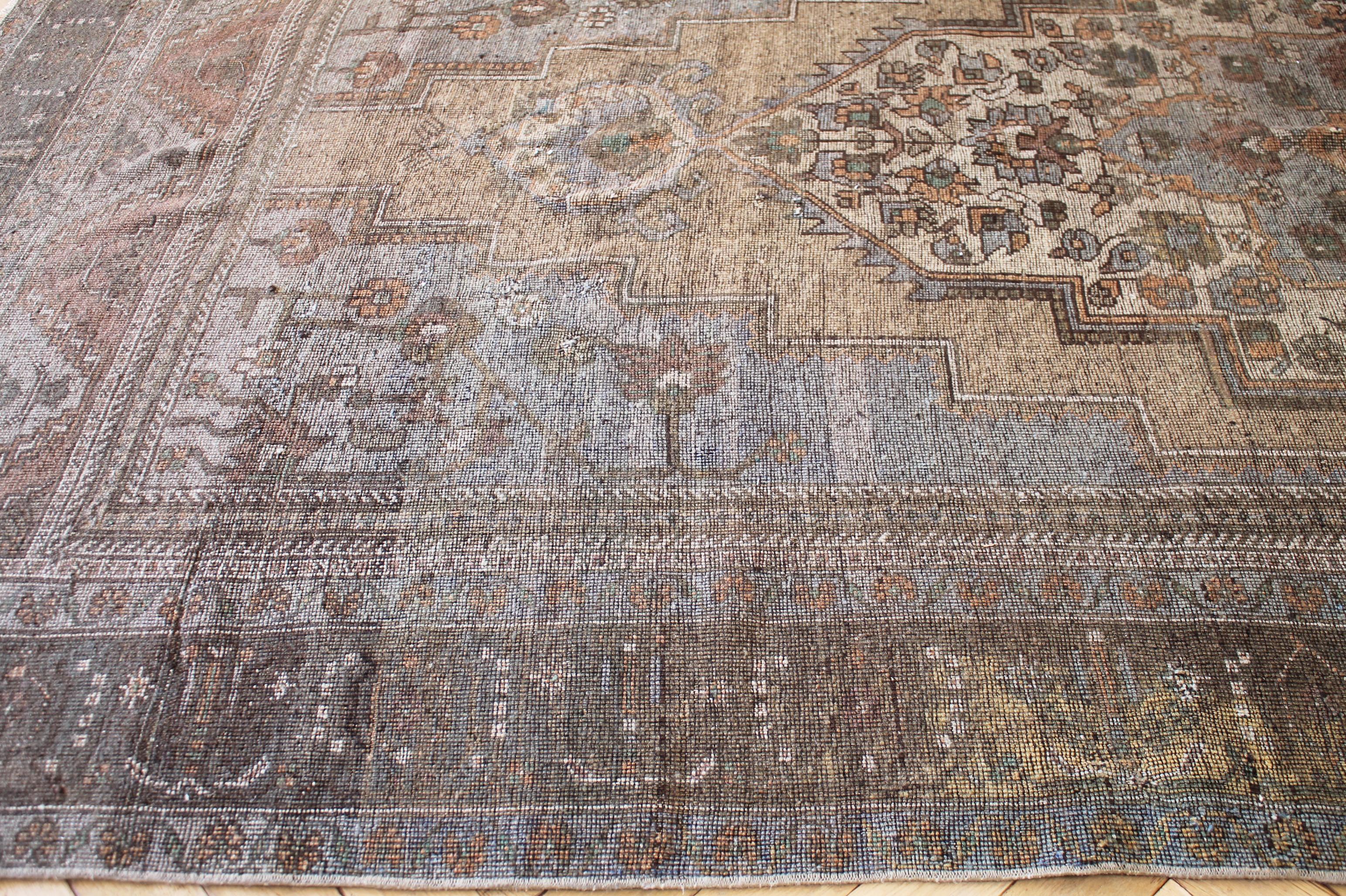 Drake II vintage Turkish rug. The warm colors as well as intricate patterns not only add character but also make the rug a one of a kind. Some pattern and color variation with vintage items is normal. This rugs contrasting colors are tans, browns,