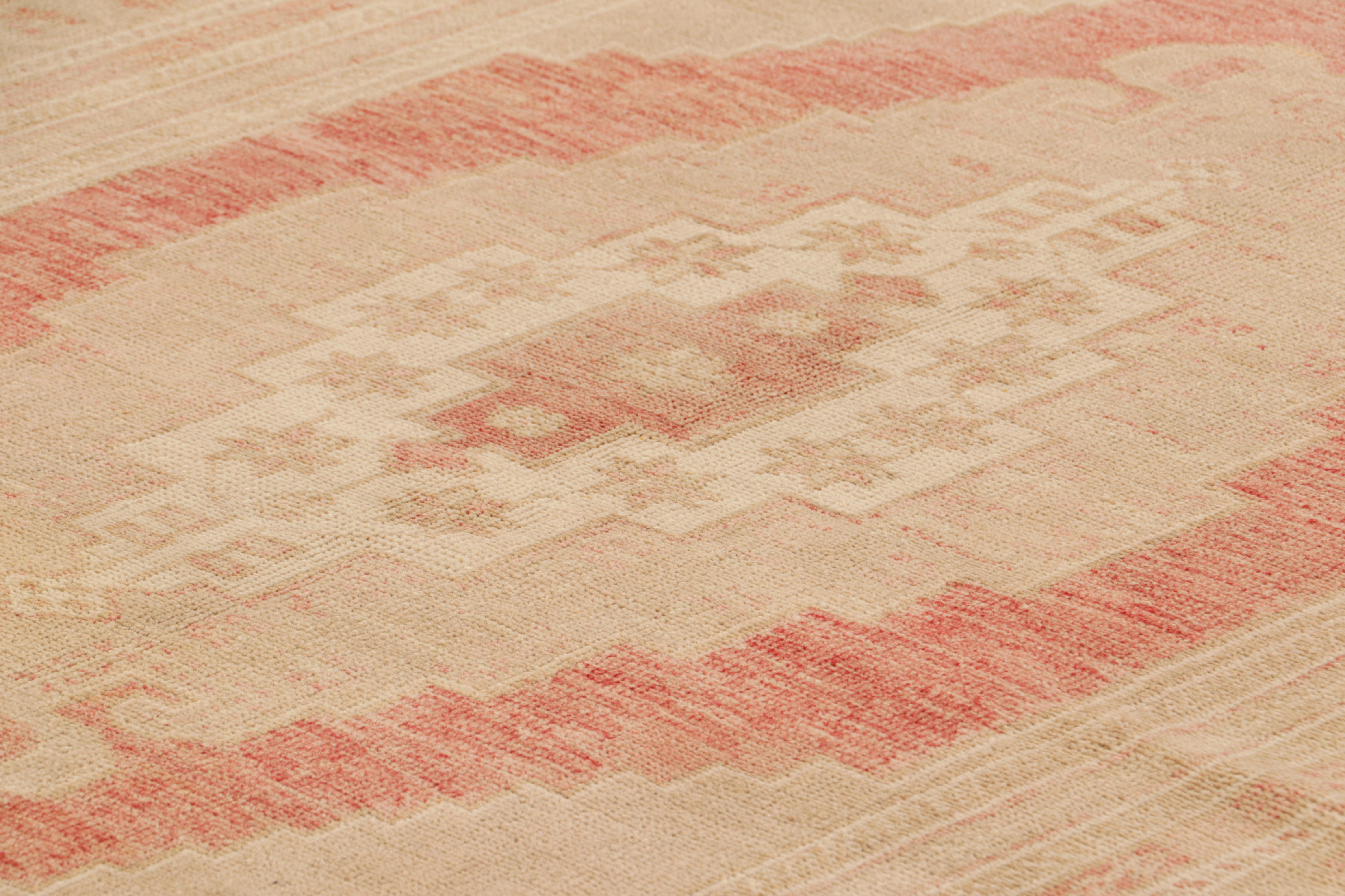 Hand-knotted in wool circa 1950-1960, this 6x9 vintage Turkish rug features interesting soft colors for a work of its provenance. 

On the Design: 

Warm tones of peach pink, red, cream white and beige-brown tones underscore a geometric design and
