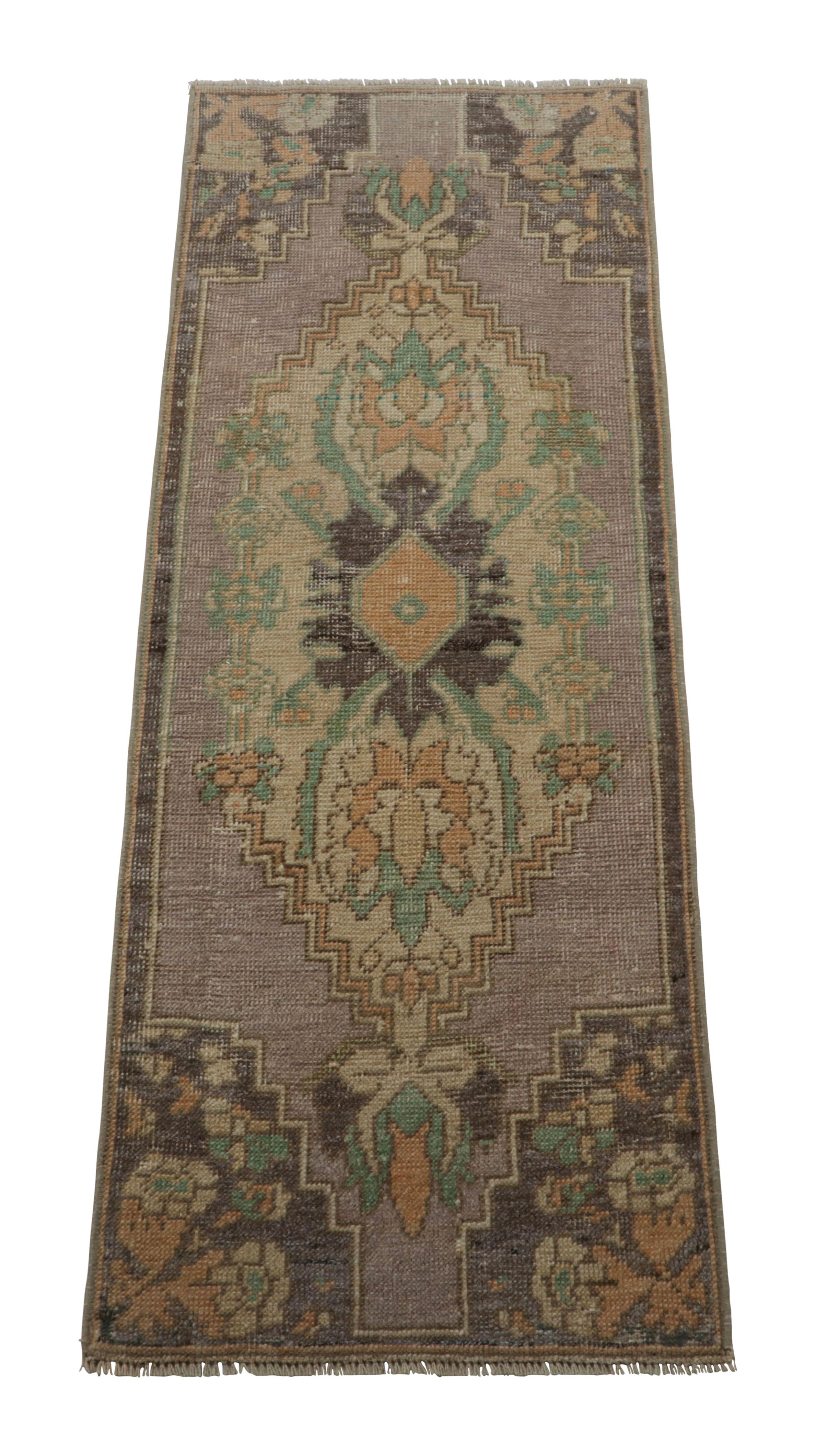 Made with hand-knotted wool, this 1x4 gift-sized vintage Turkish rug originating circa 1950-1960, is from the collection of mid-century rugs with antique washes giving them that old-world, almost distressed look to them.

On the Design: 

Purple and
