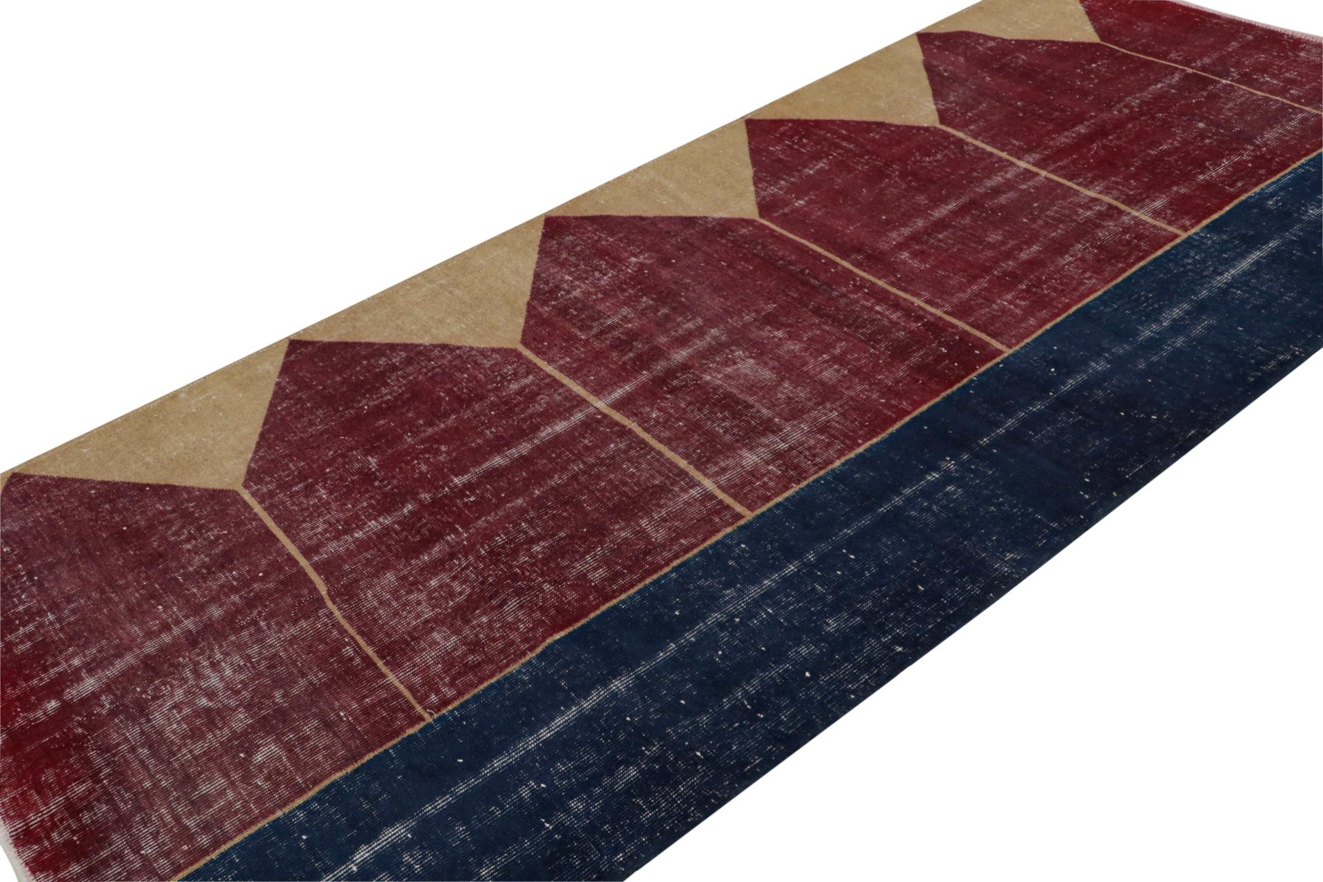 Hand Knotted in wool, this distressed vintage 4x9 Turkish rug, which is inspired by Saf rugs, a particular kind of prayer rug, features a red field and geometric patterns in hues of bronze and navy blue.  

On the Design: 

Connoisseurs will admire