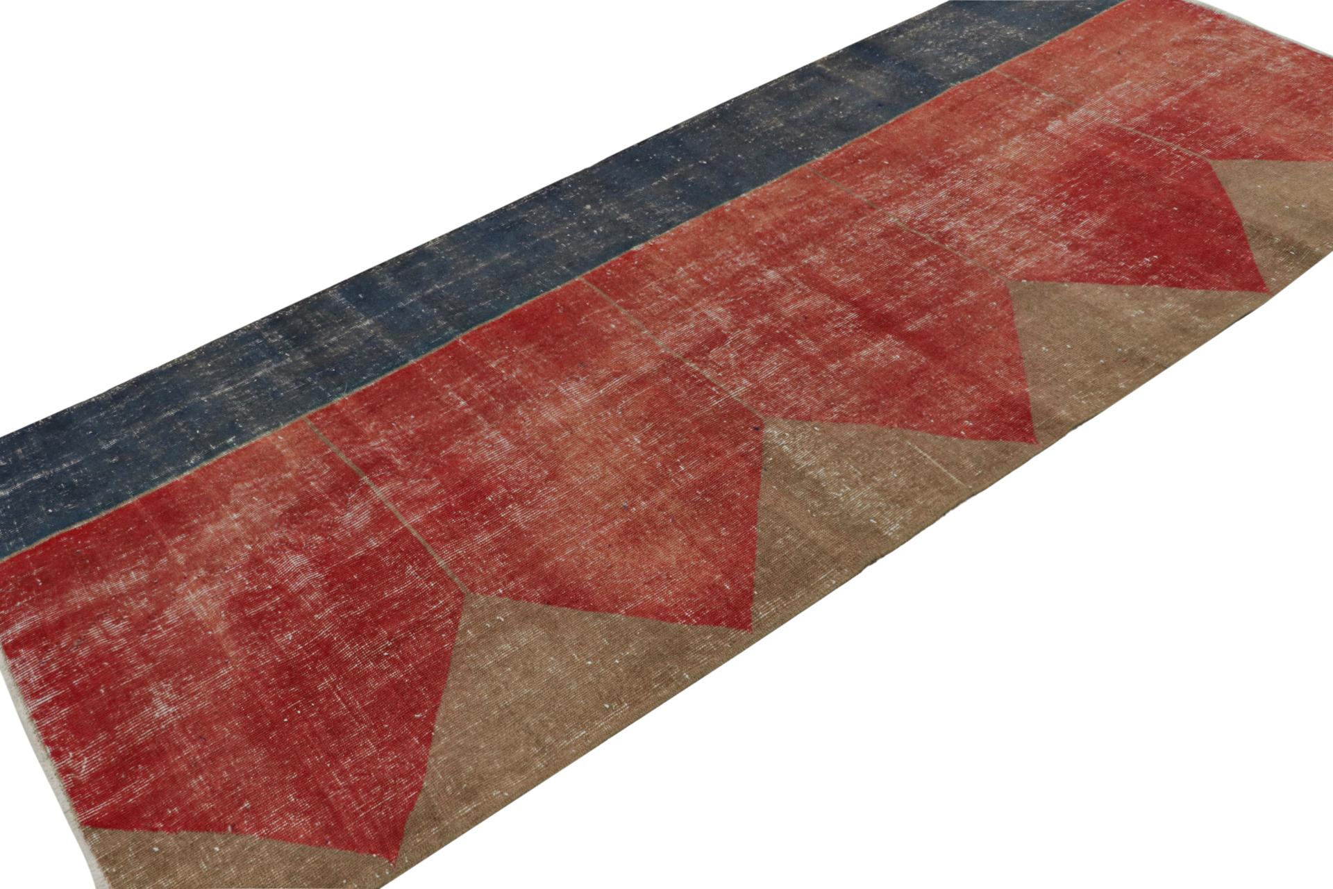 Hand Knotted in wool, this distressed vintage 4x10 Turkish rug, which is inspired by Saf rugs, a particular kind of prayer rug, features a red field and geometric patterns in hues of bronze and navy blue.  

On the Design: 

Connoisseurs will admire
