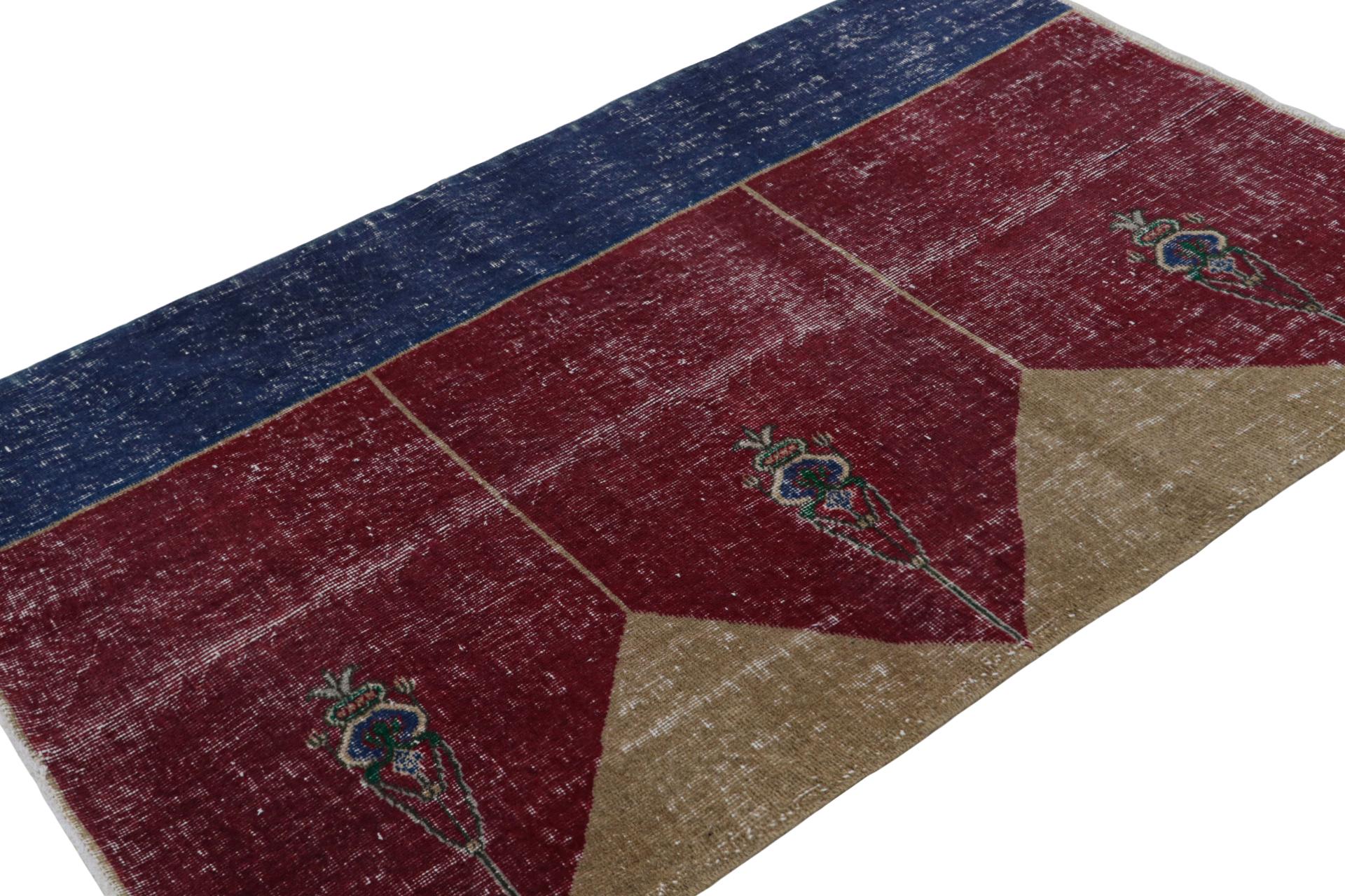 Hand-knotted in wool, this distressed vintage 4x6 Turkish rug, which is inspired by Saf rugs, a particular kind of prayer rug, features a red field and geometric patterns in hues of bronze and navy blue.  

On the Design: 

Connoisseurs will admire