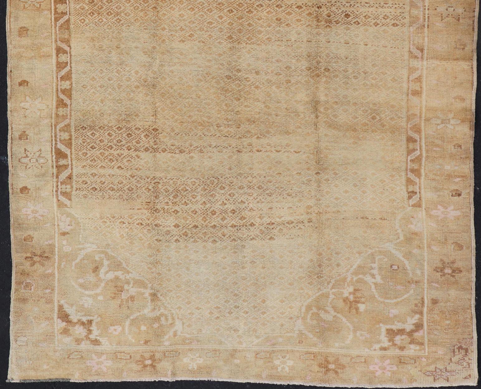 Hand-Knotted Vintage Turkish Rug with All-Over Diamond Design and Floral Border in Neutrals For Sale