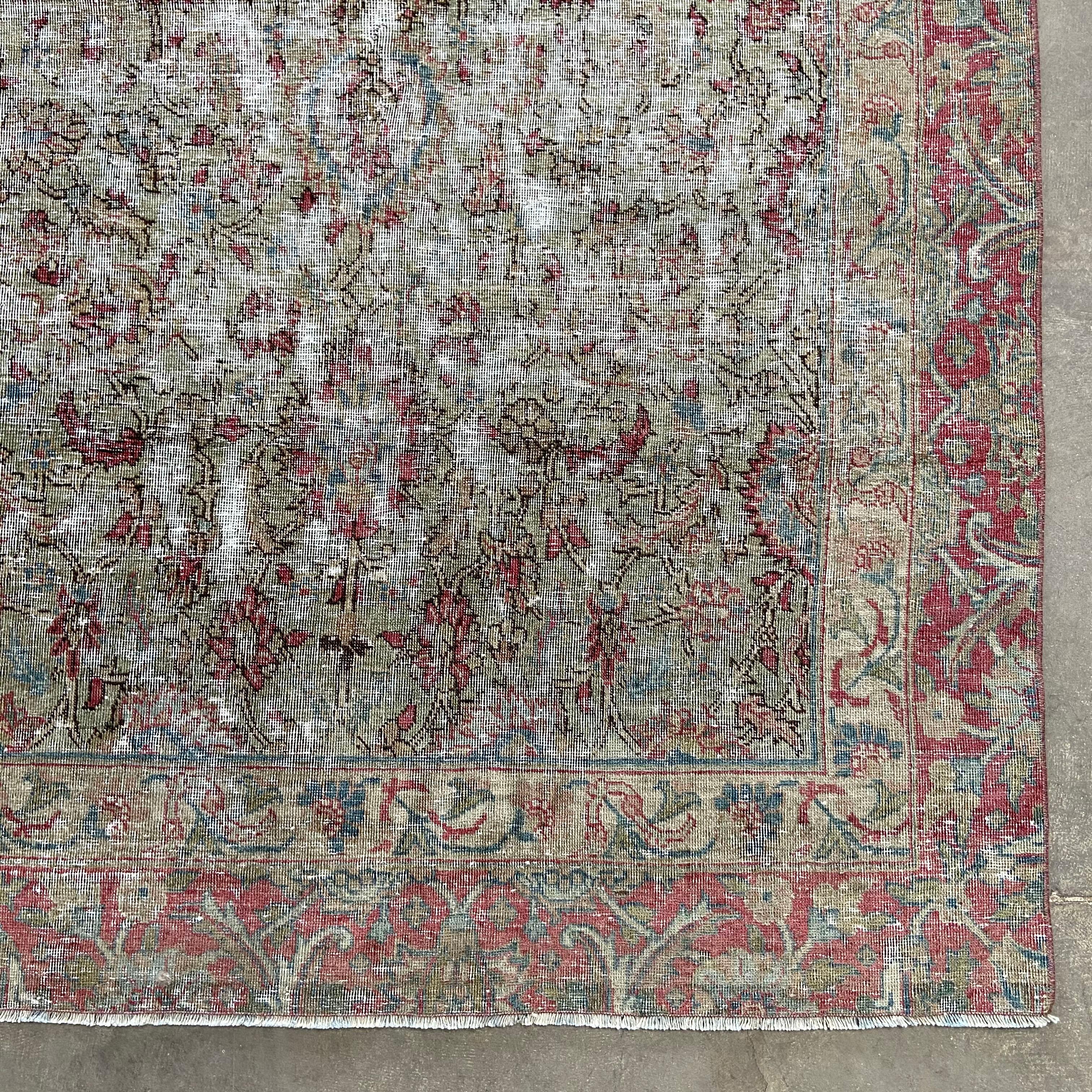 Vintage Turkish rug in faded red and moss greens. The warm colors as well as intricate patterns not only adds character but also makes it truly one-of-a-kind. Some pattern and color variation with vintage items is normal. Beautiful rug has a deep